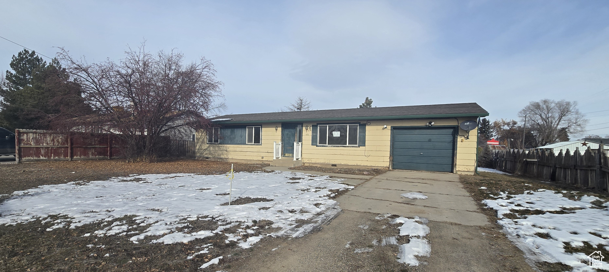 View of front facade featuring a garage