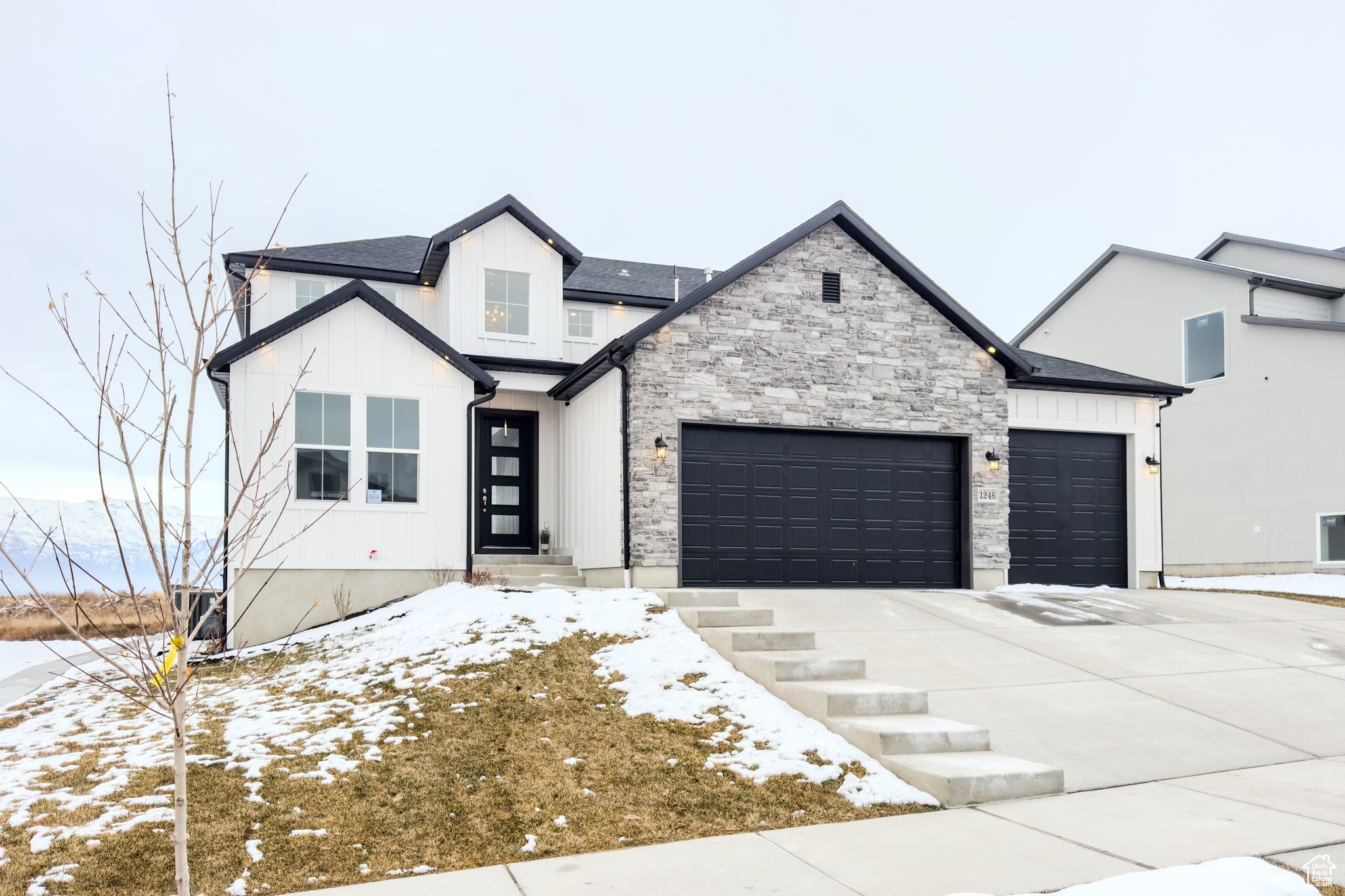 Modern farmhouse featuring a garage