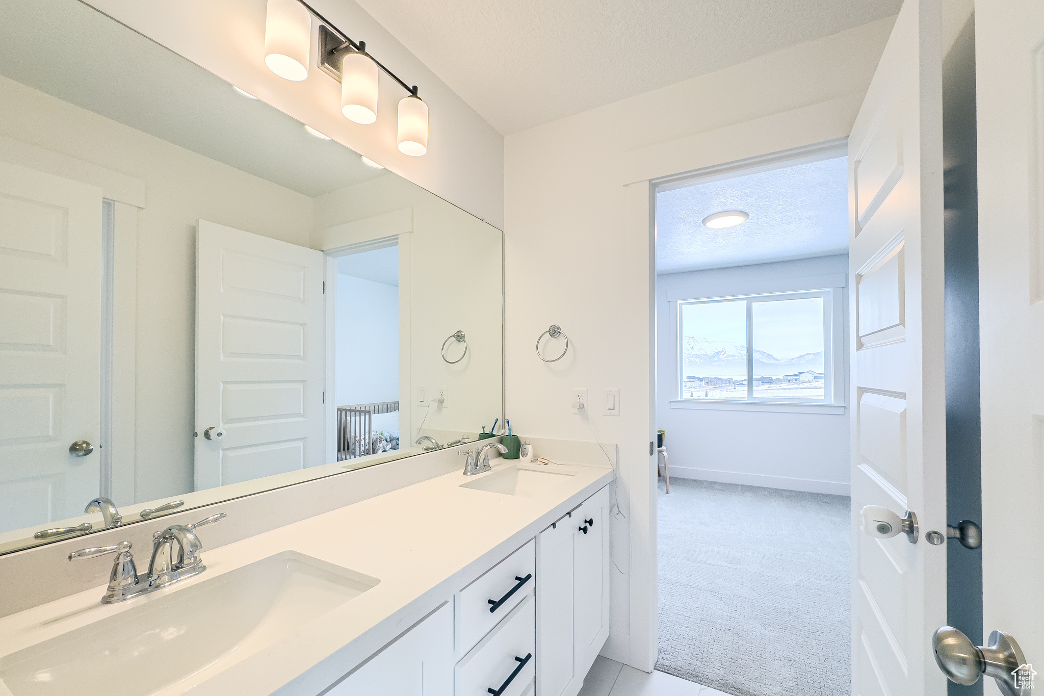 Bathroom with vanity and a textured ceiling