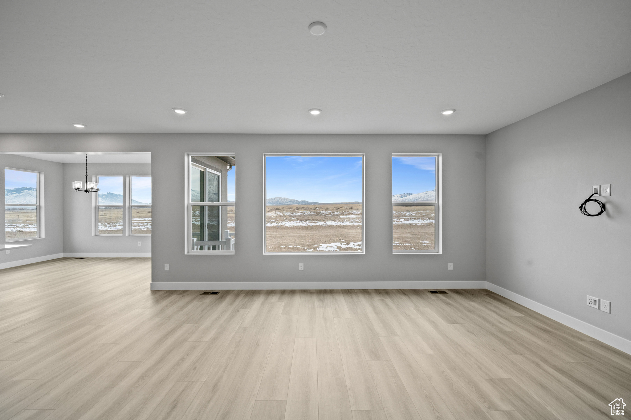 Interior space featuring an inviting chandelier and light wood-type flooring