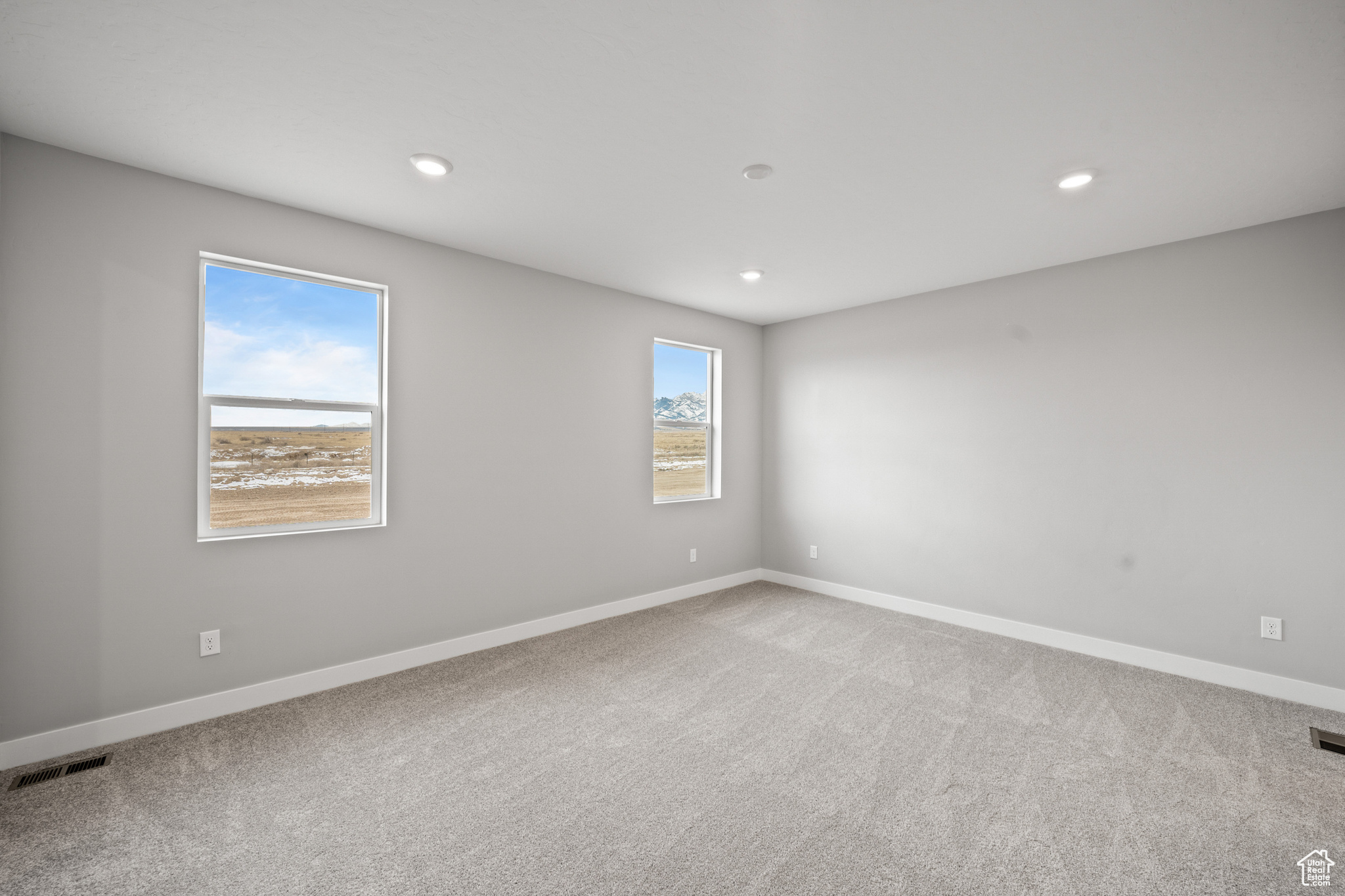 View of carpeted spare room