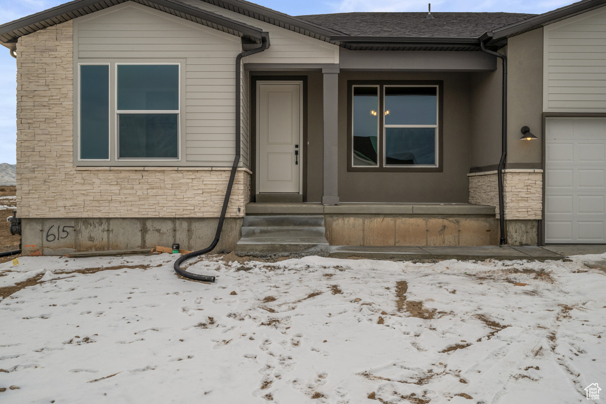 View of snow covered property entrance