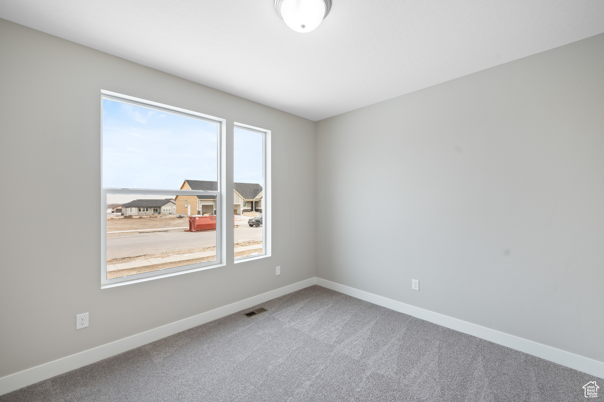 Spare room featuring carpet floors