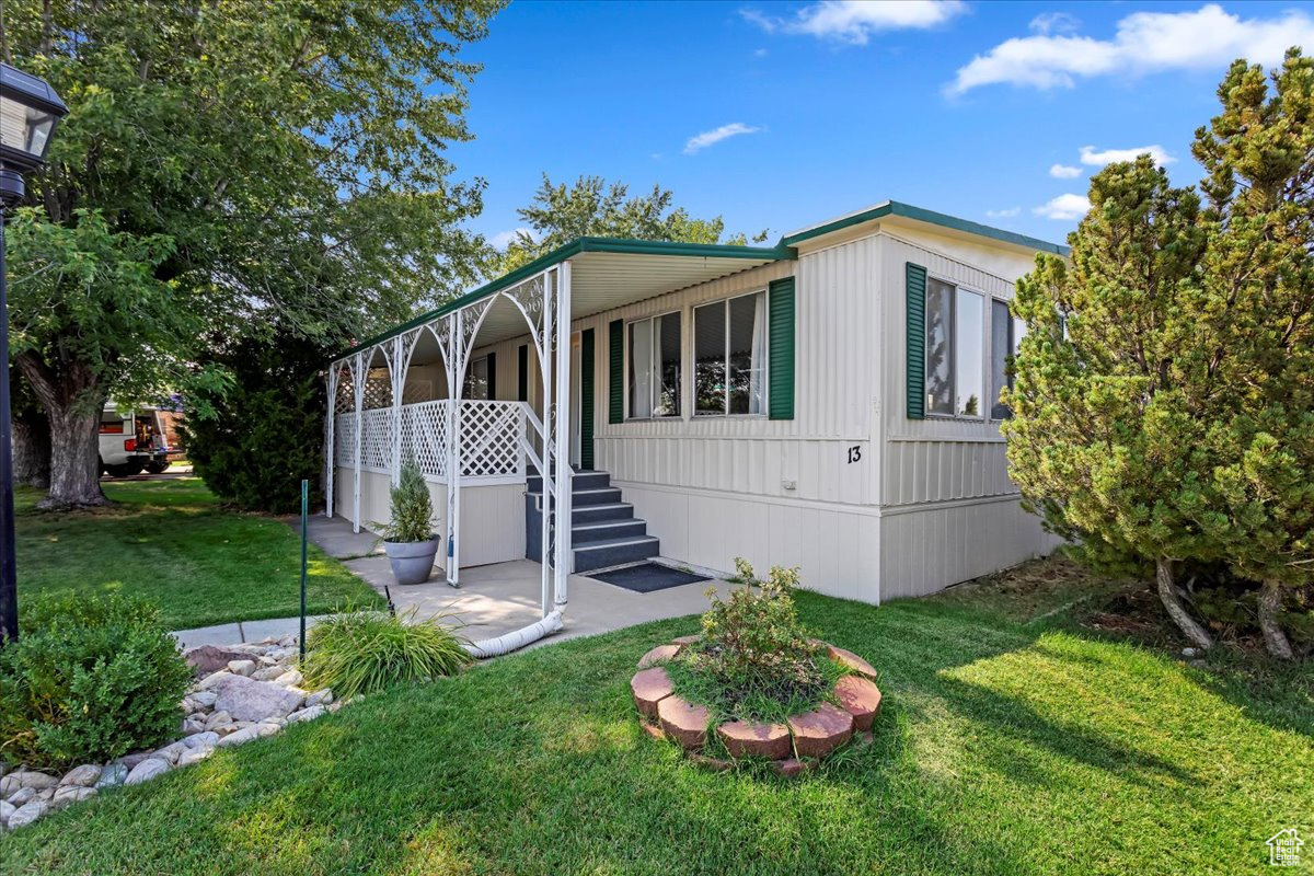 View of front of property with a front lawn