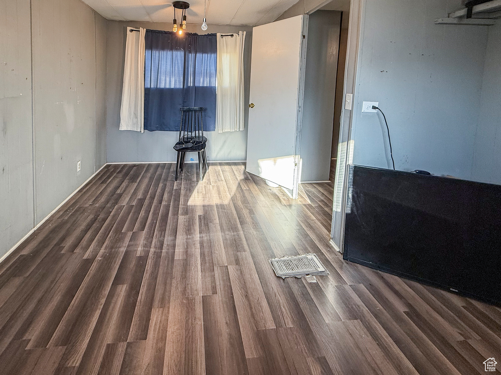 Interior space featuring dark wood-type flooring