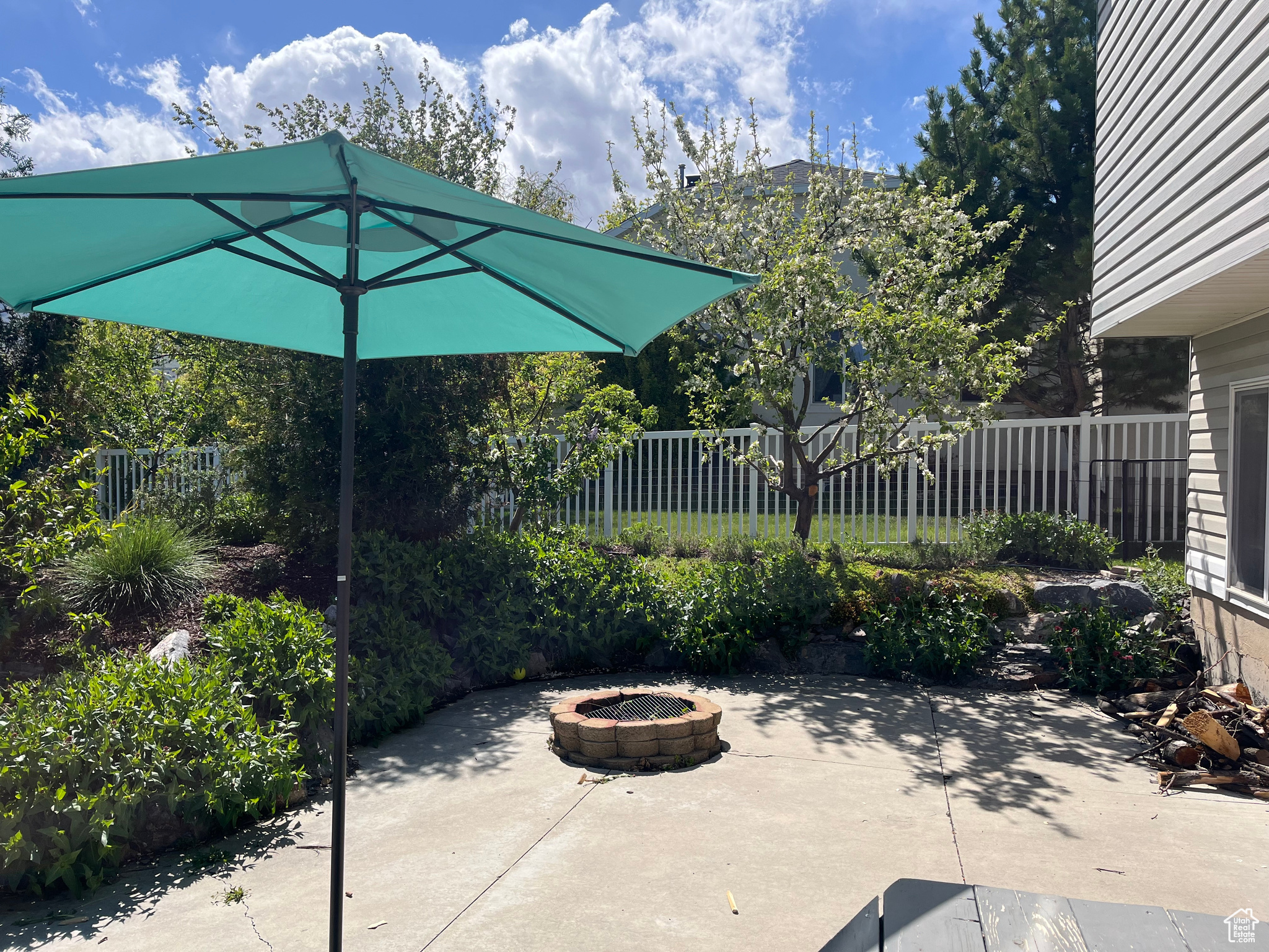 View of patio / terrace with an outdoor fire pit