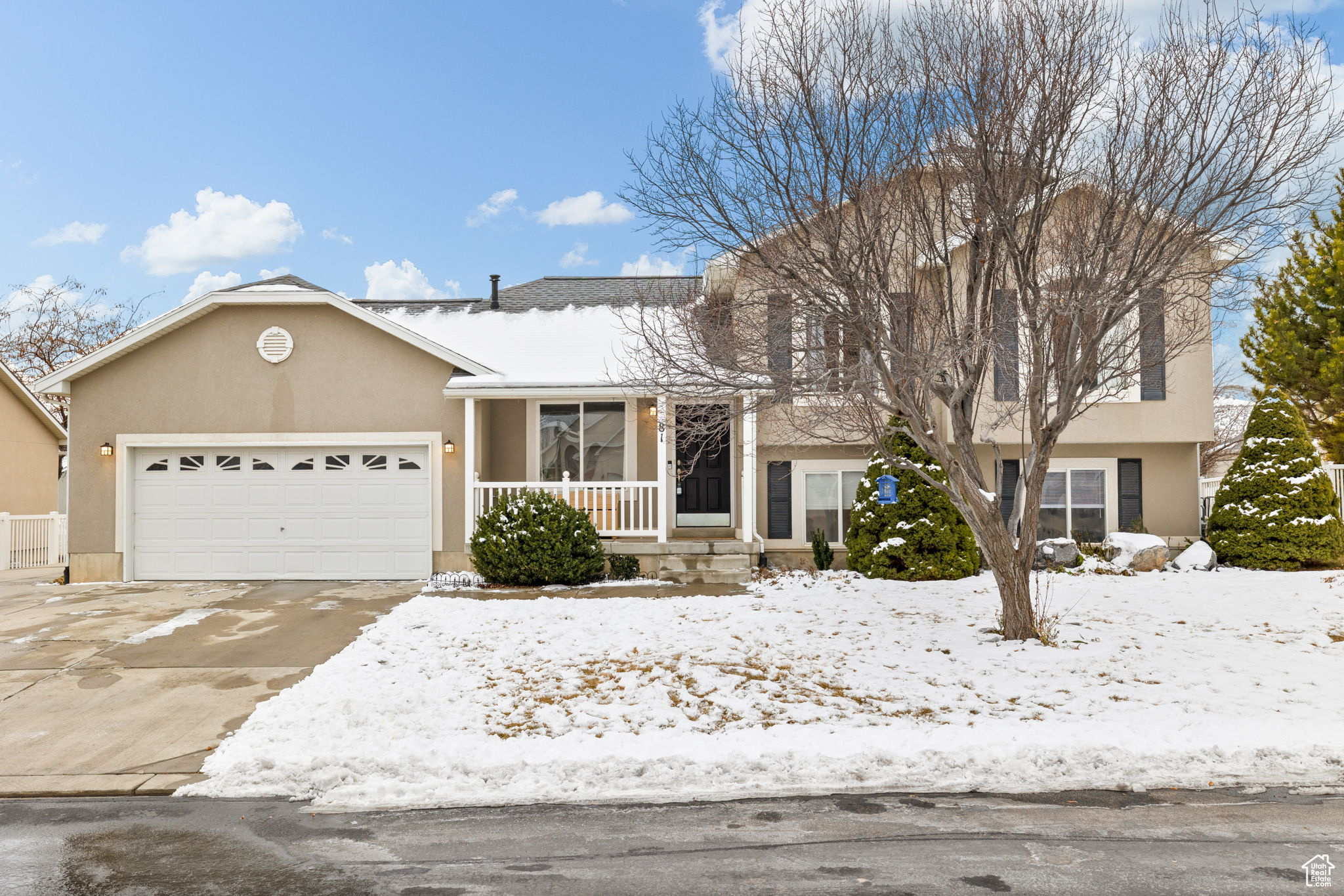 View of front of property featuring a garage