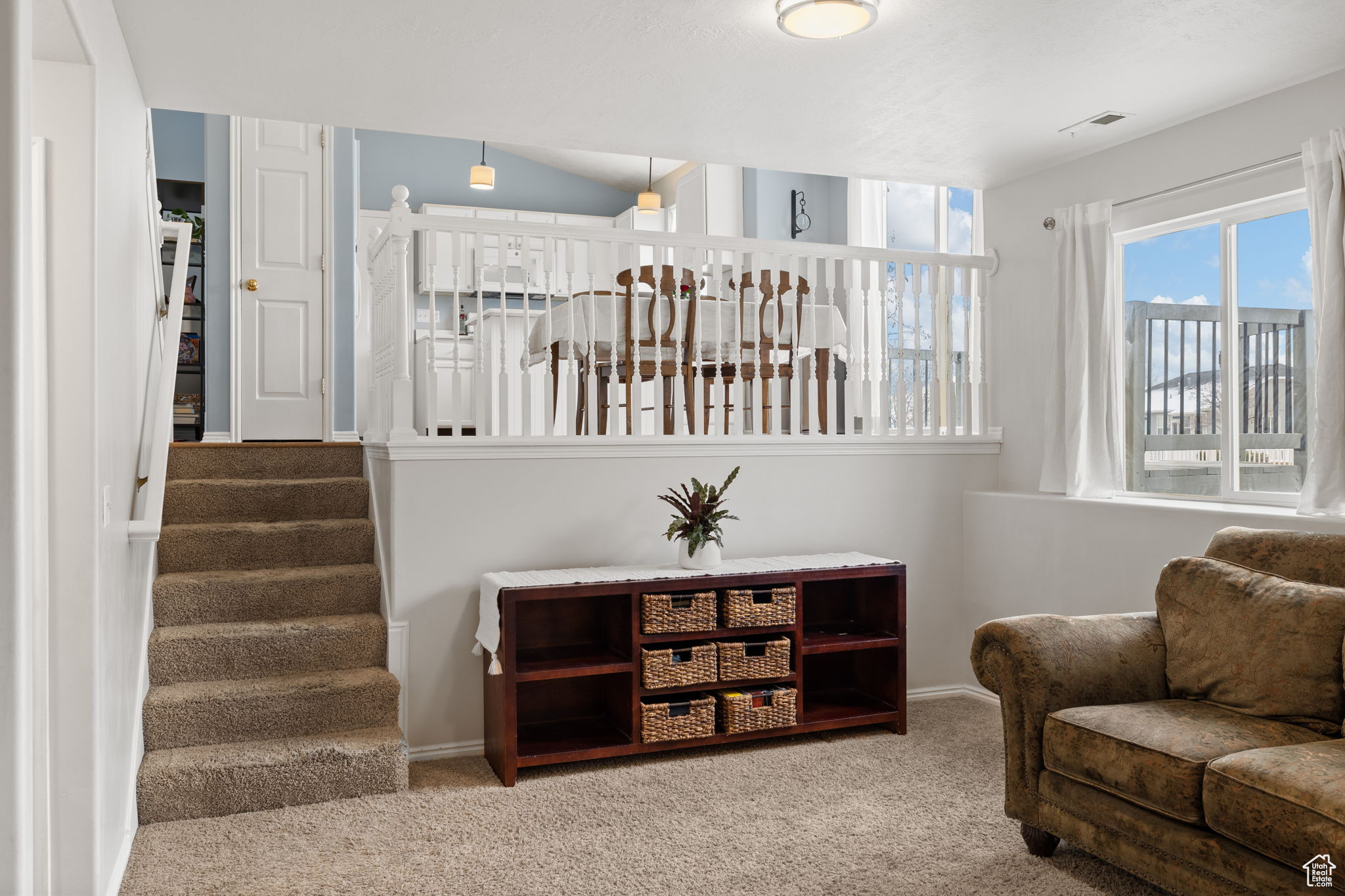 Sitting room featuring carpet floors