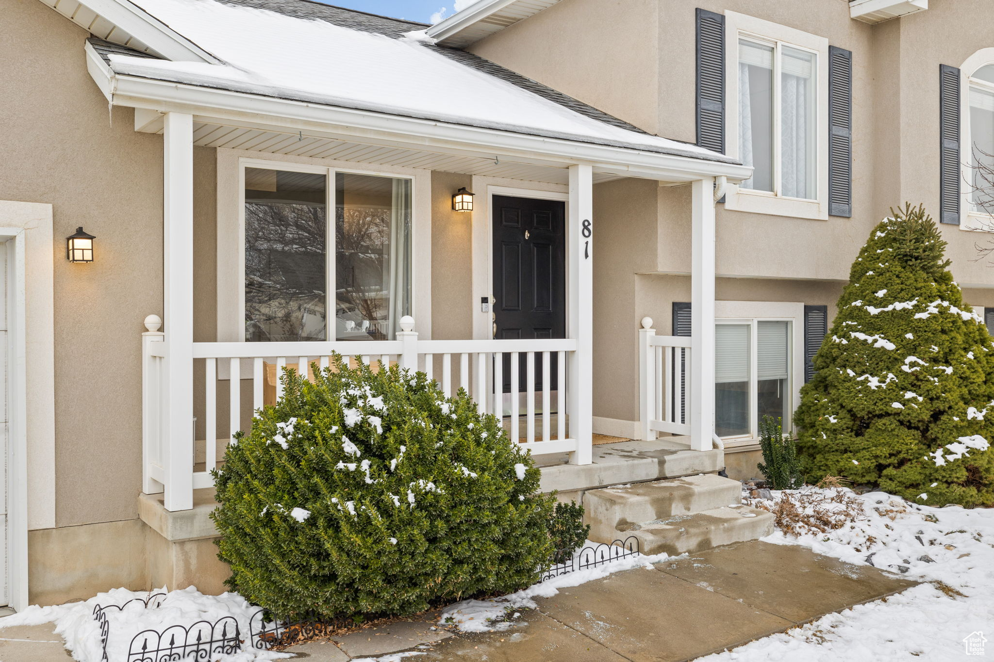 View of snow covered property entrance