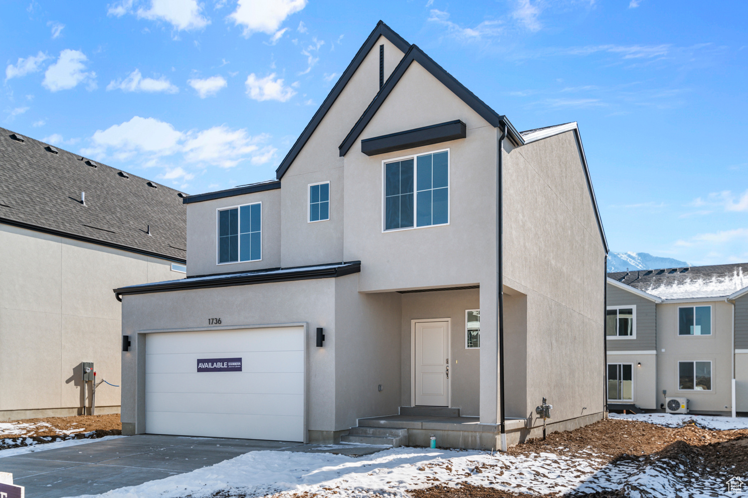 View of front of property with a garage