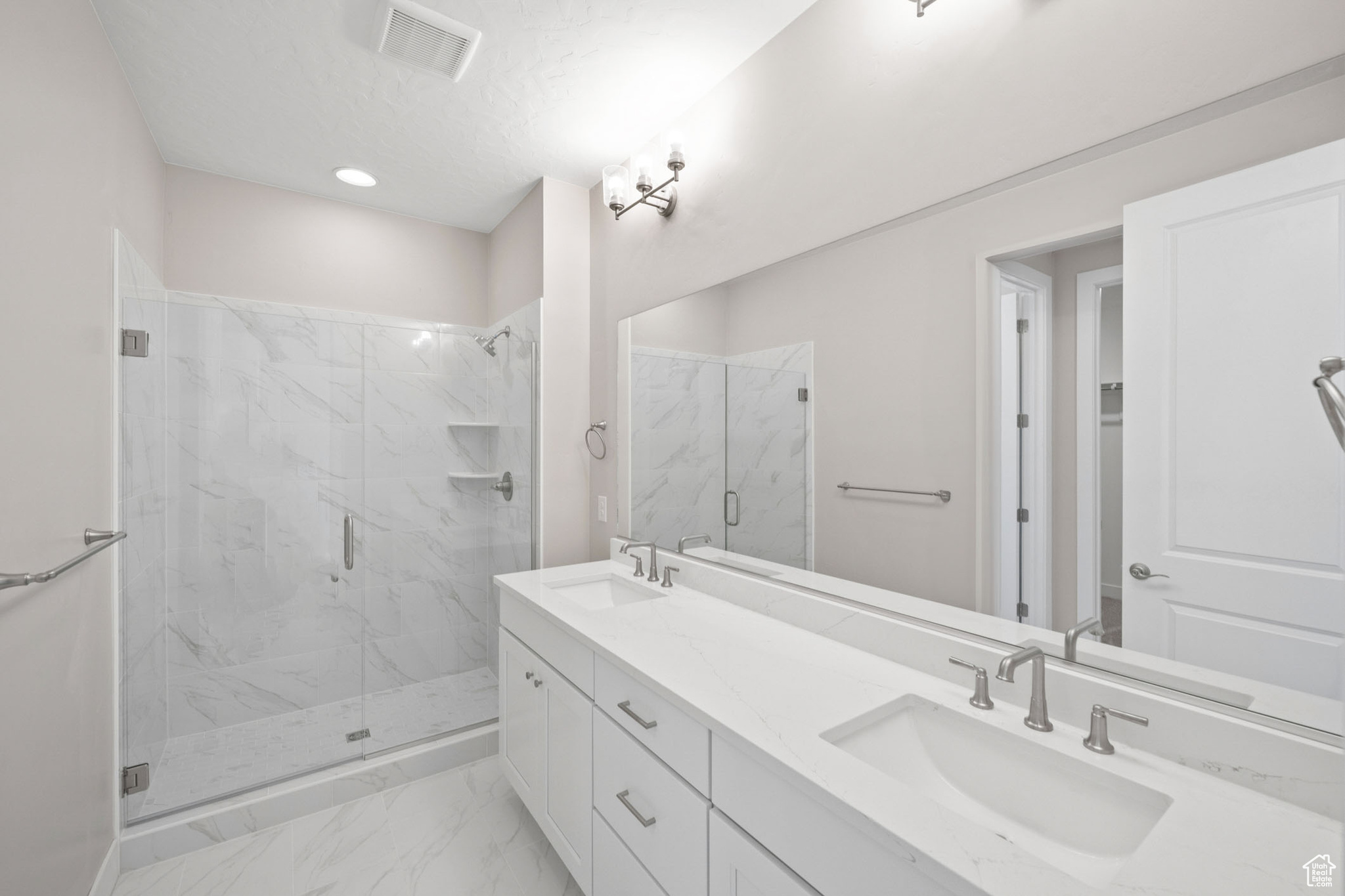 Bathroom with vanity and an enclosed shower