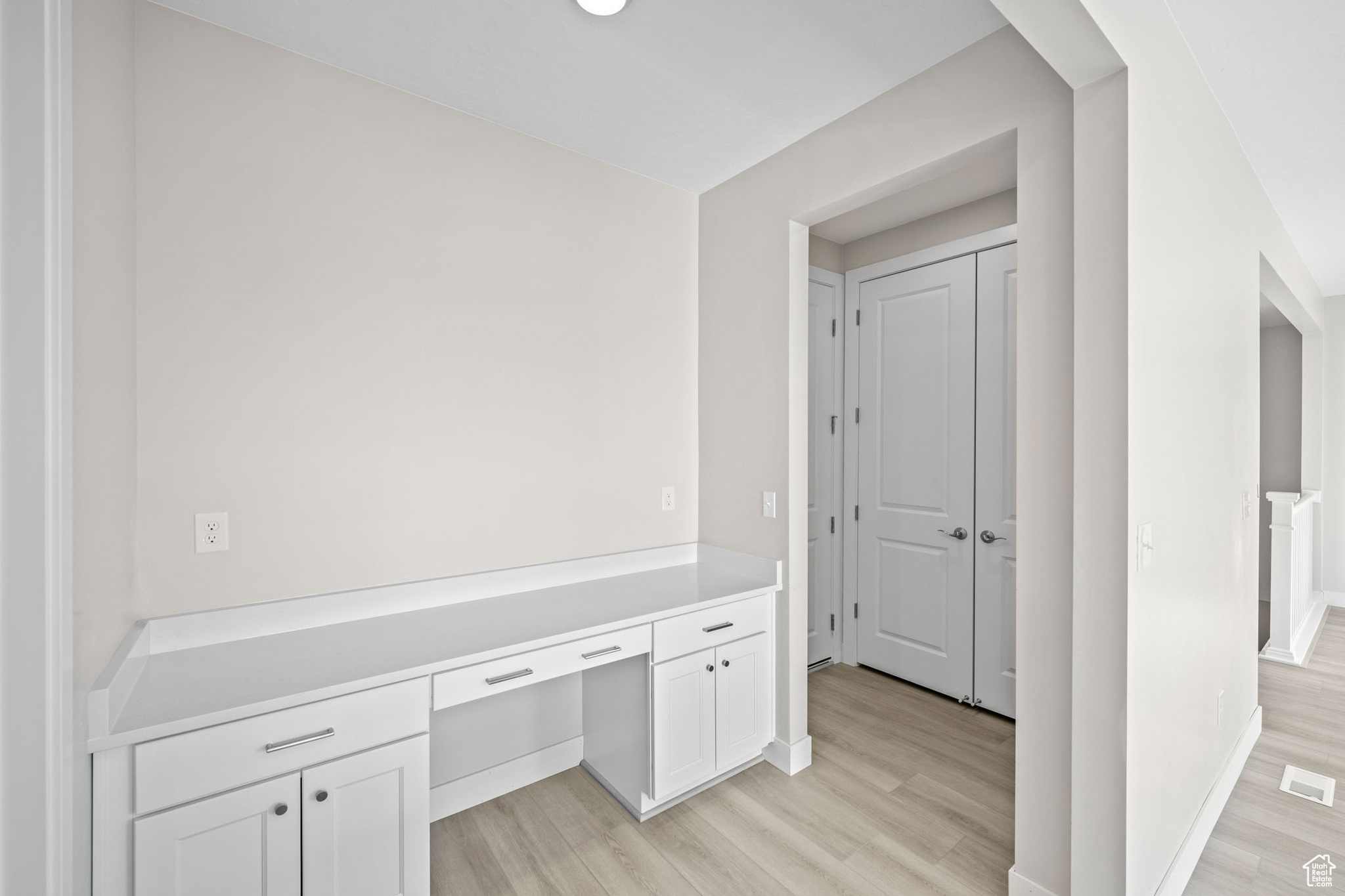 Hallway featuring light hardwood / wood-style flooring