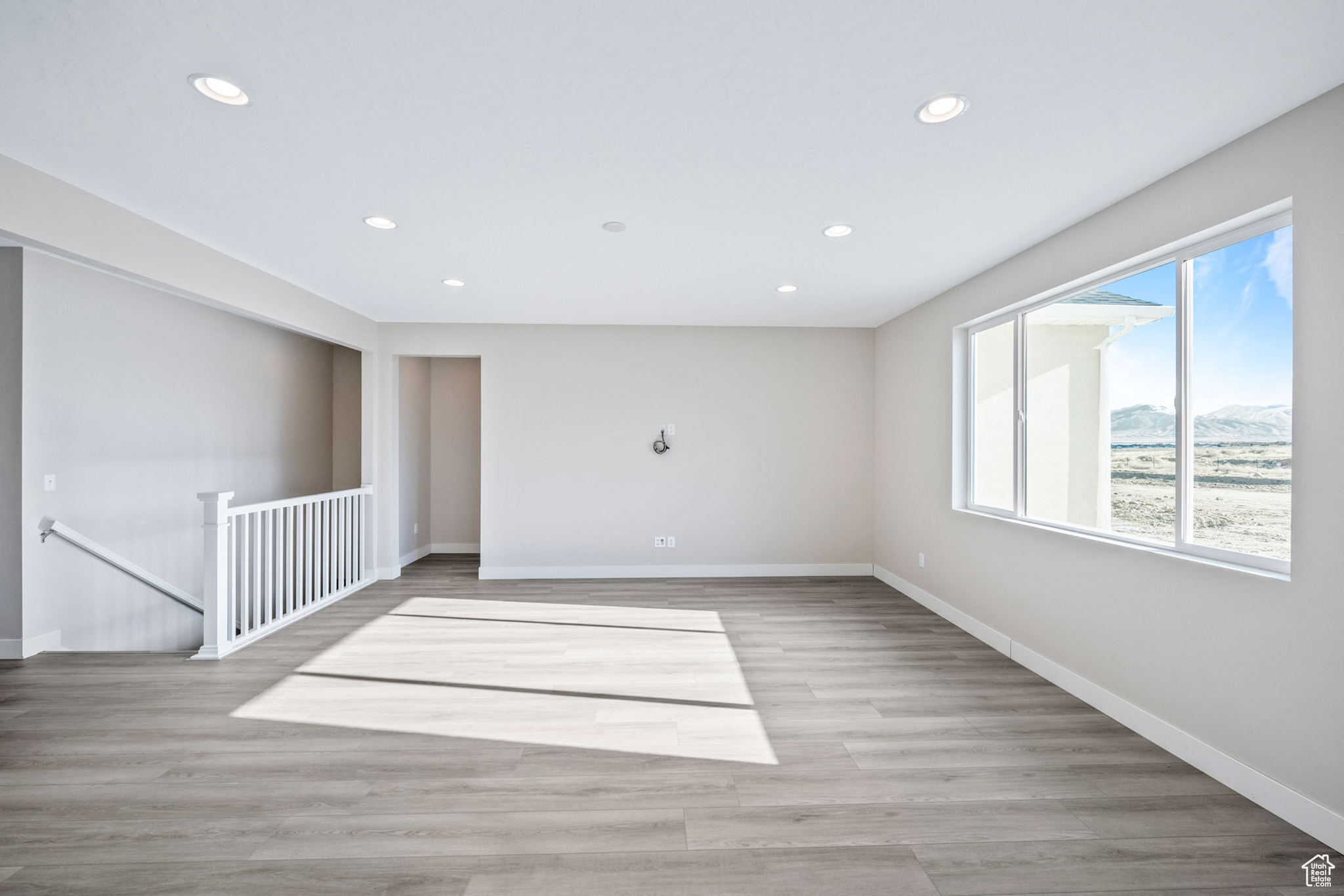 Spare room with light hardwood / wood-style floors