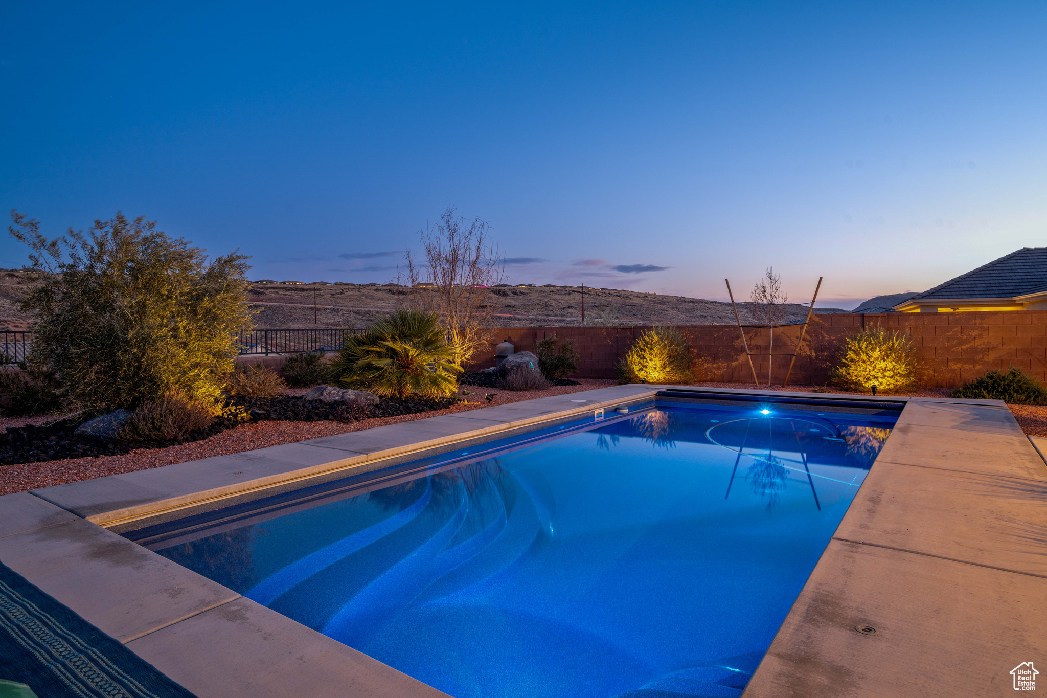 View of pool at dusk