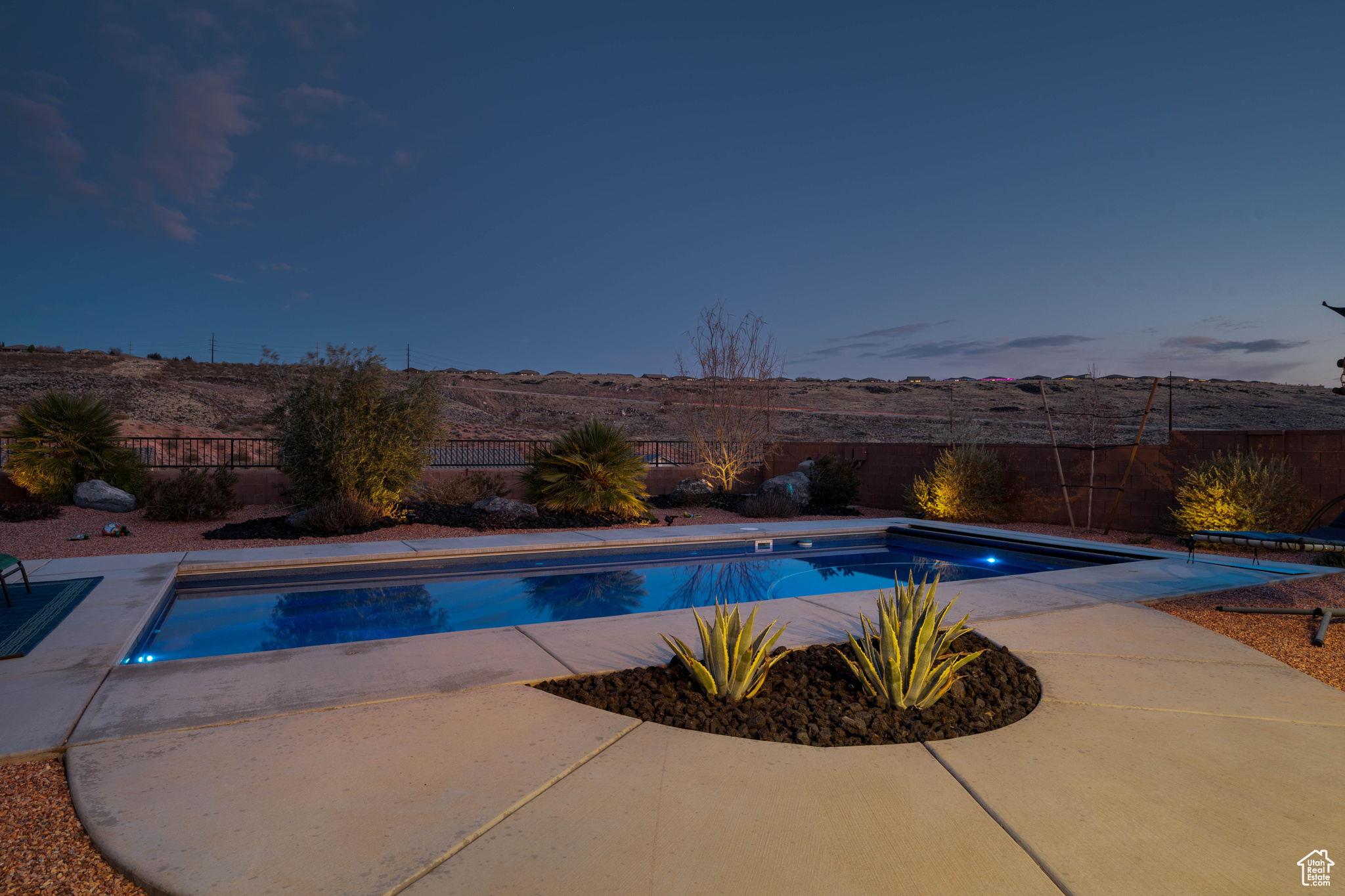 View of pool at dusk