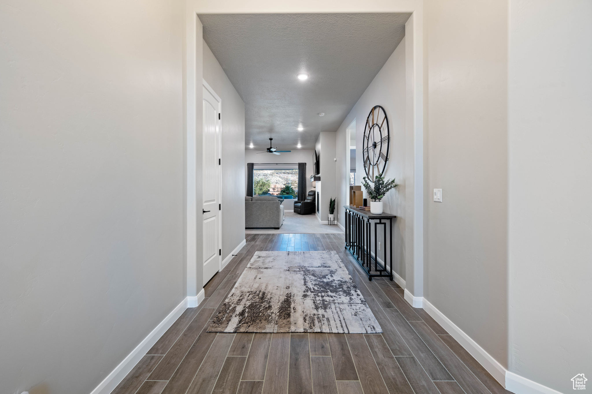 Hallway with a textured ceiling