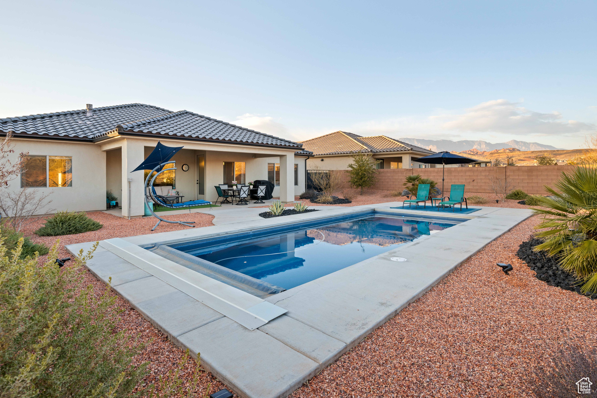 View of swimming pool featuring a patio and a mountain view