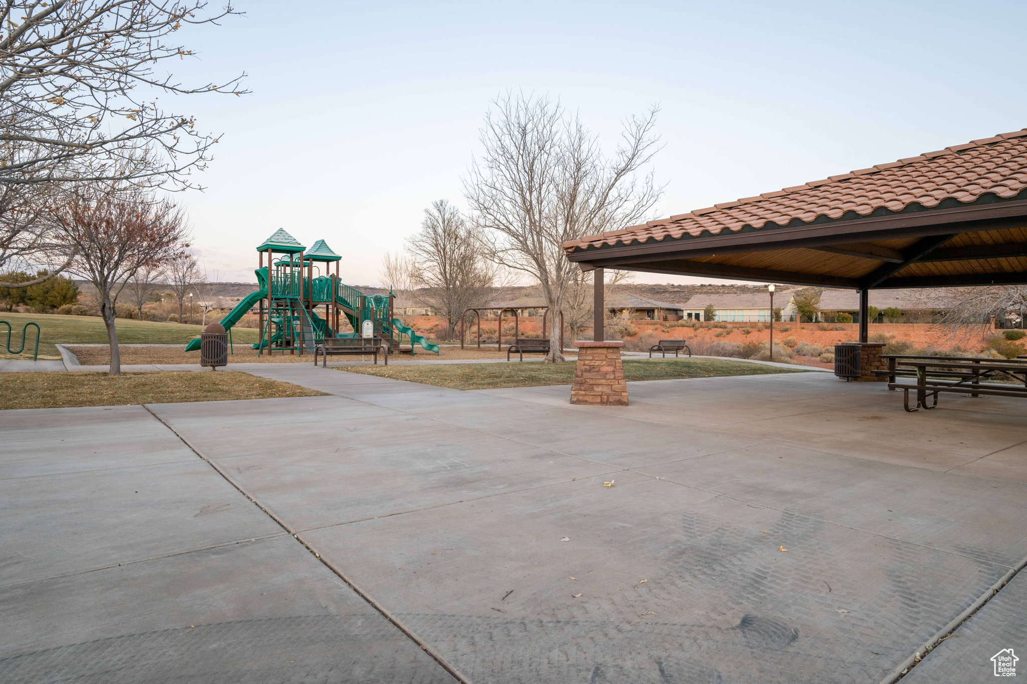 Playground at dusk featuring a gazebo