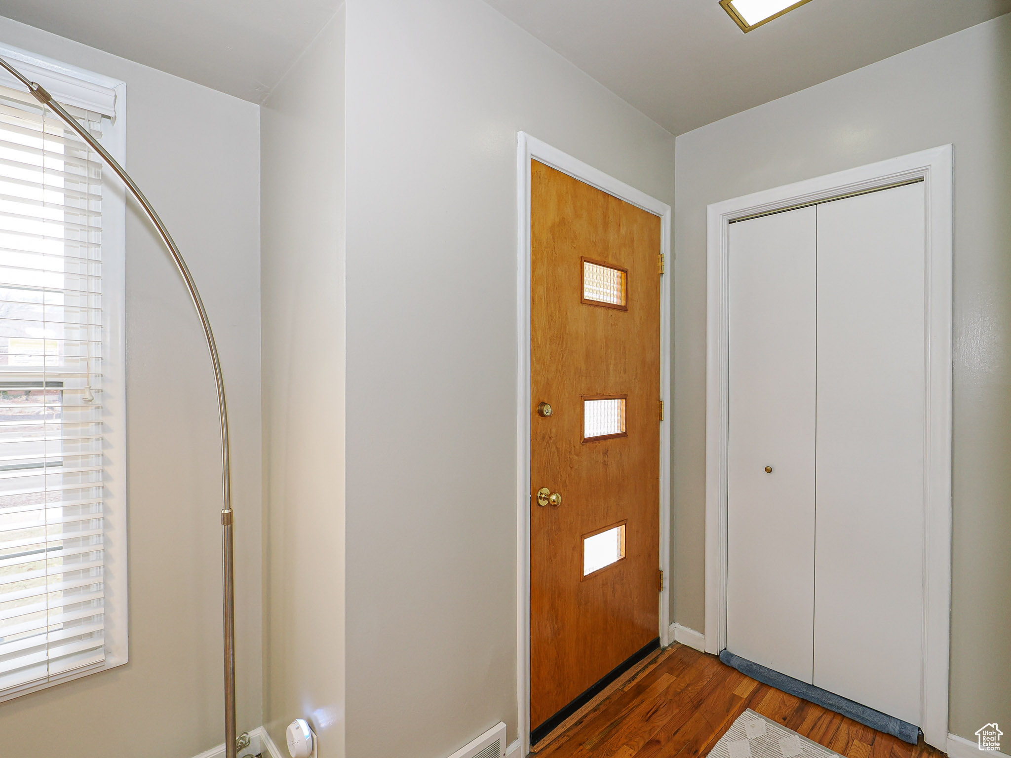 Entryway with hardwood / wood-style flooring