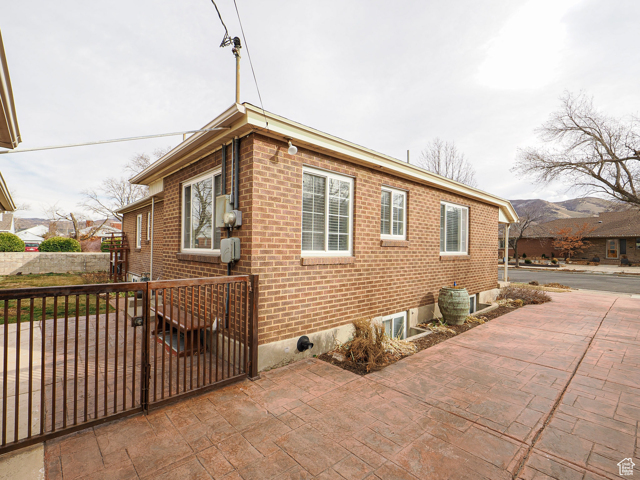 View of side of home with a patio