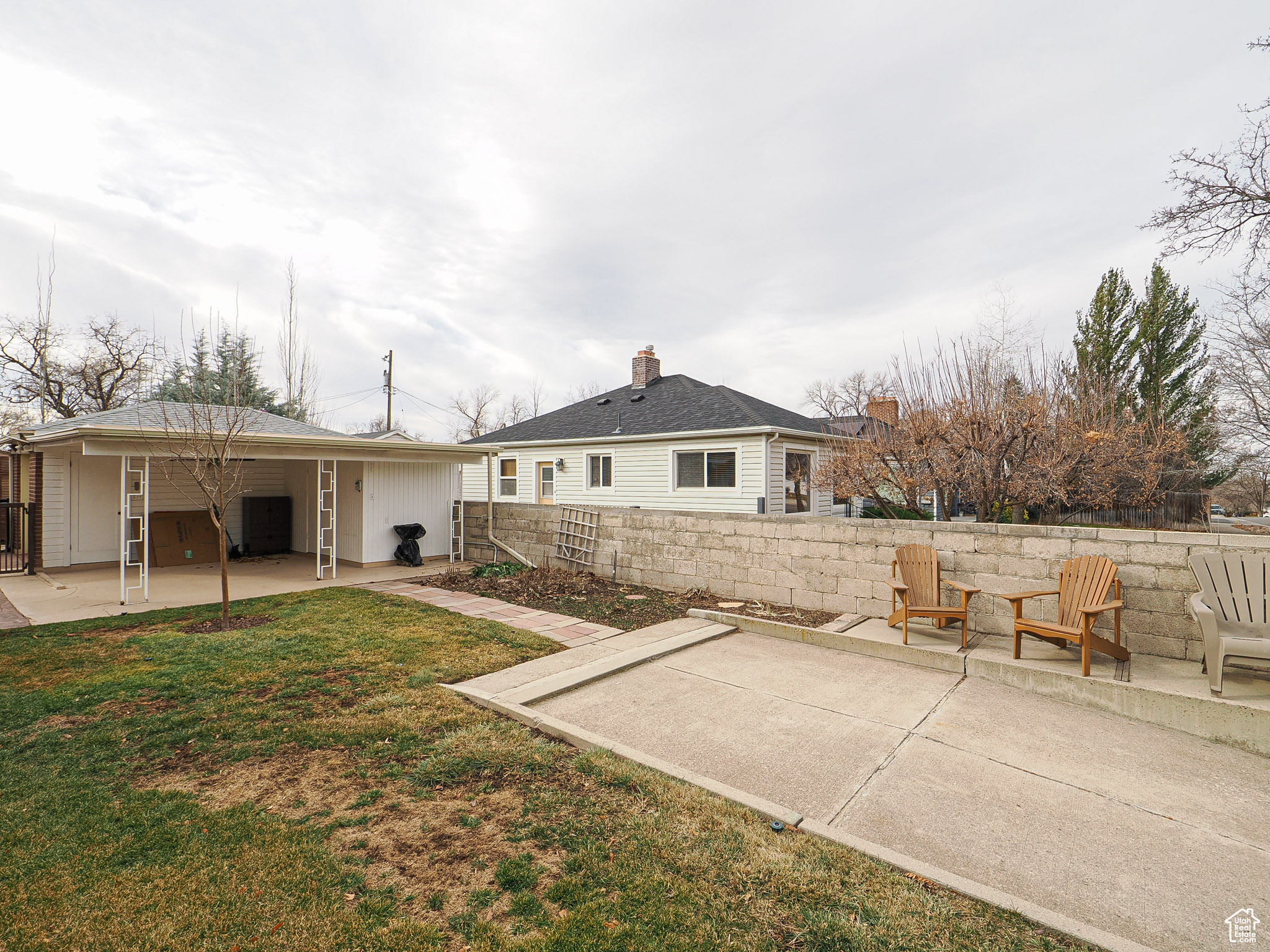 Back of house with a yard, a patio, and central air condition unit