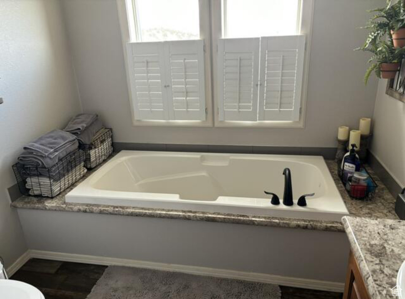 Bathroom featuring vanity and a bath