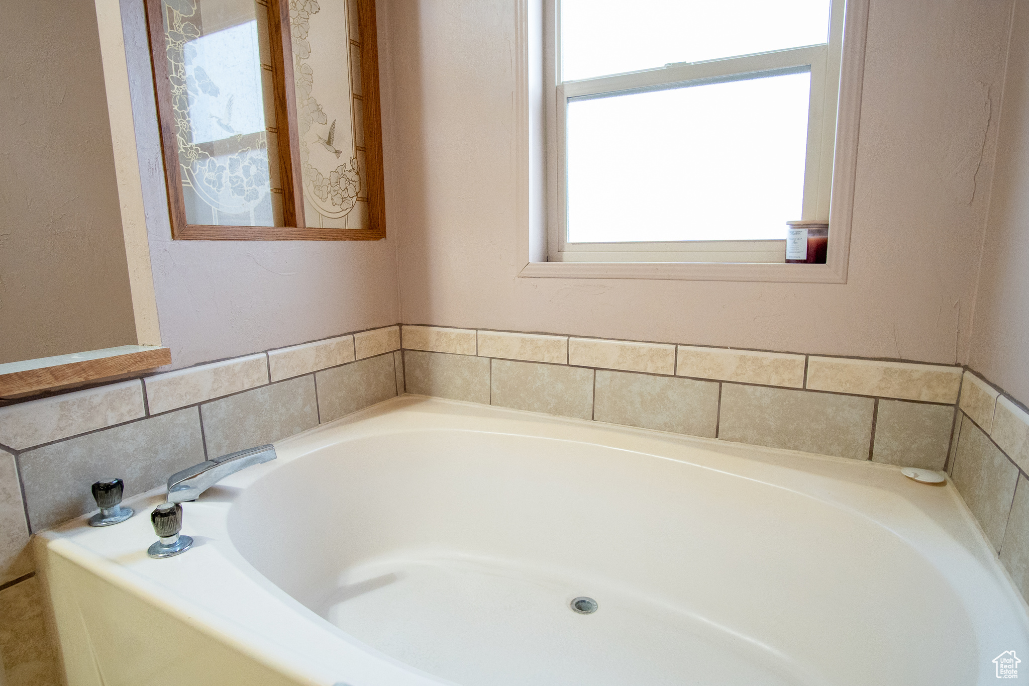 Bathroom with a washtub