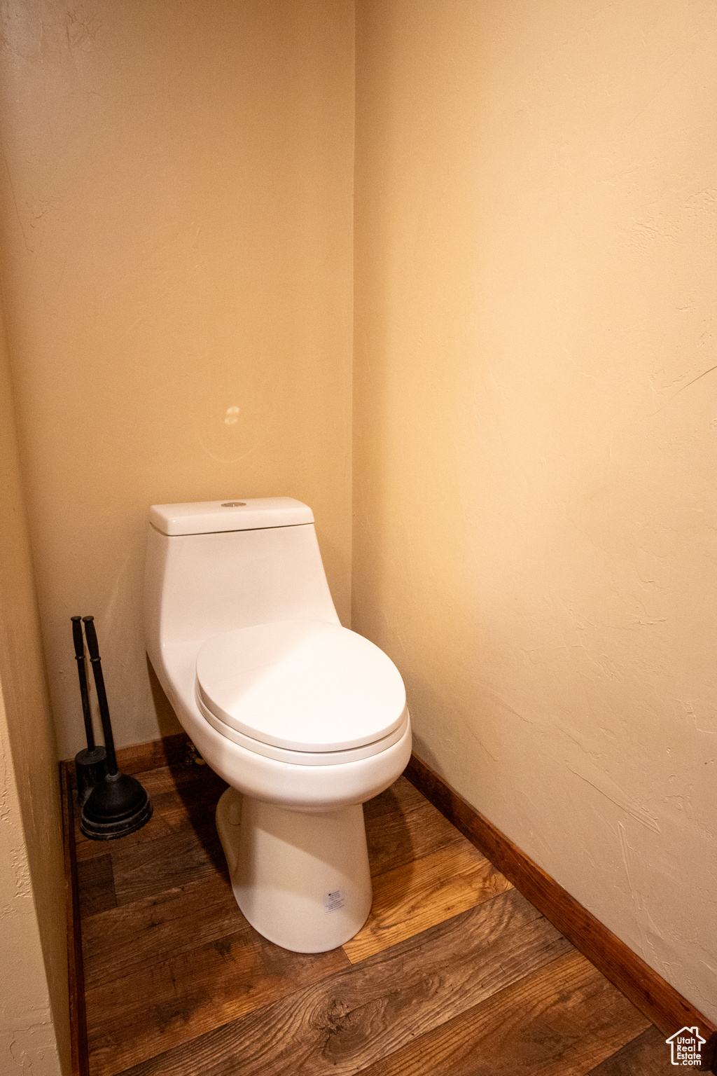 Bathroom featuring toilet and hardwood / wood-style floors