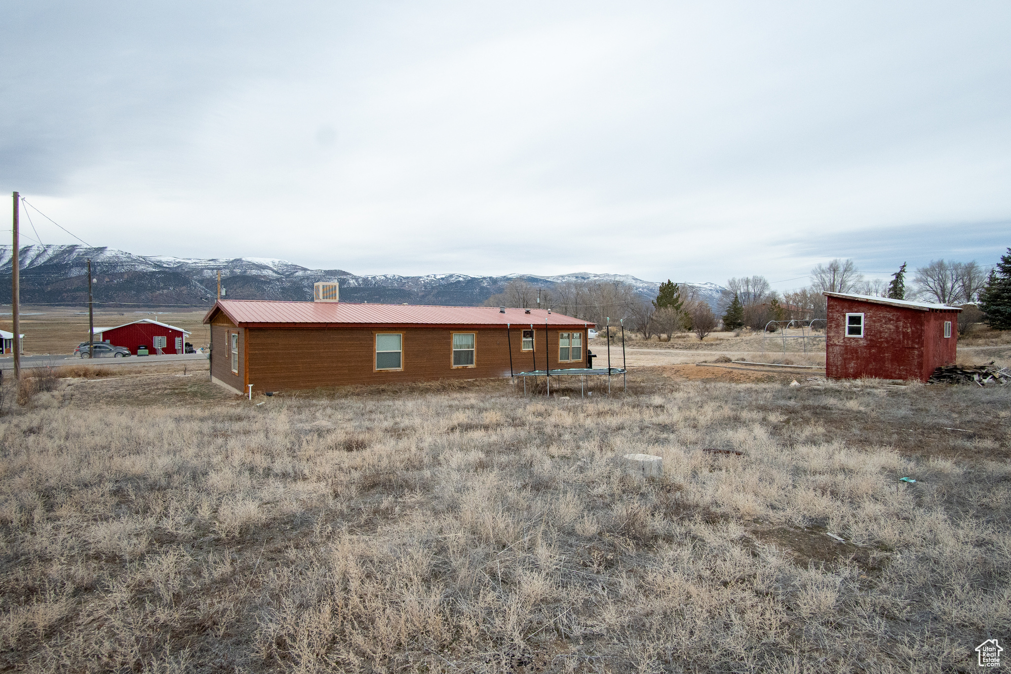 Exterior space featuring a mountain view and an outdoor structure