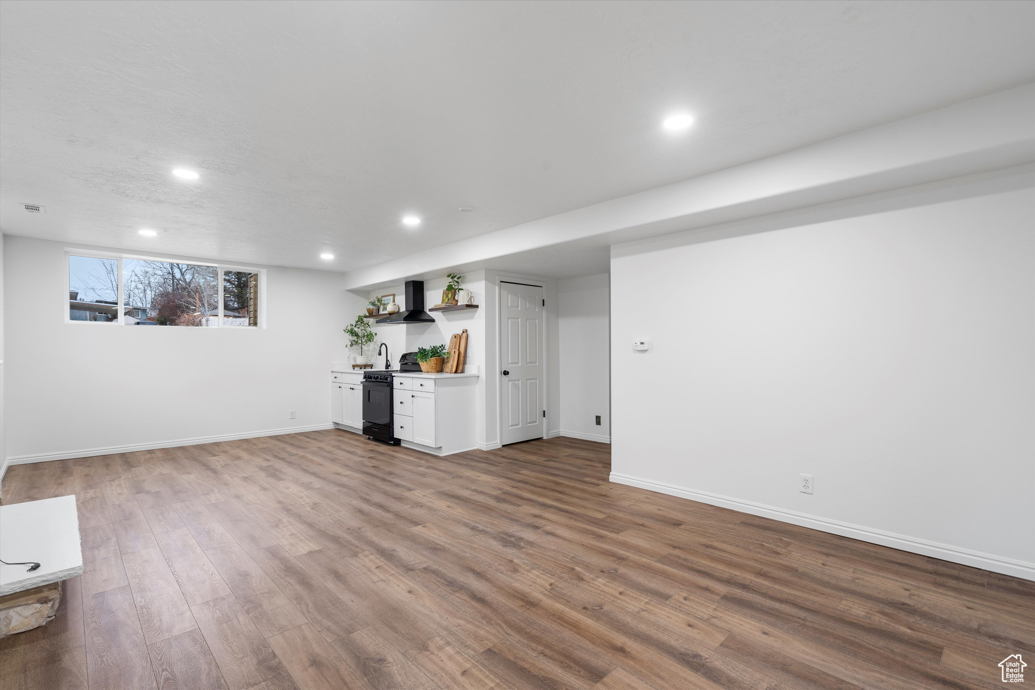 Unfurnished living room with wood-type flooring