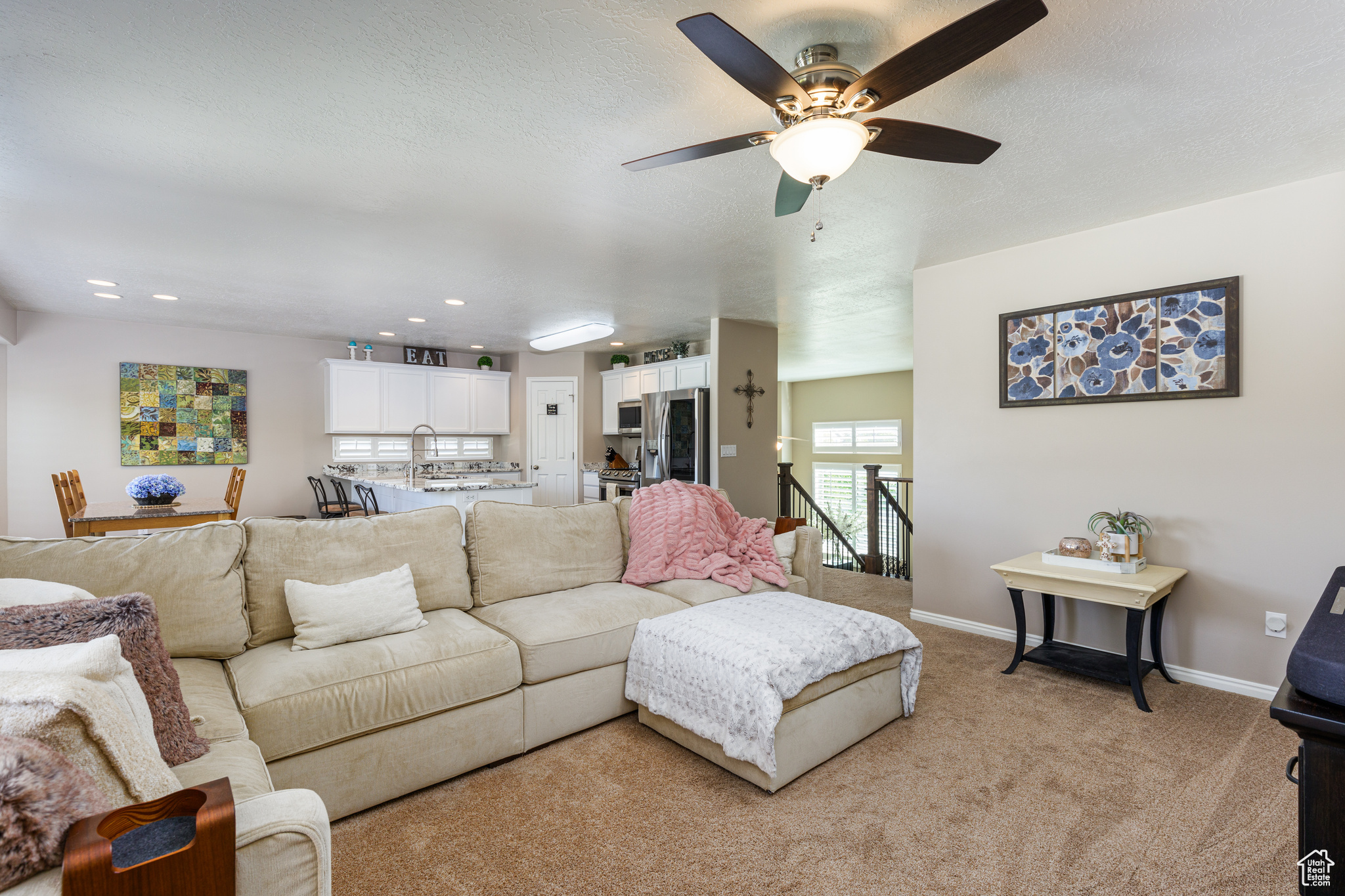 Living room featuring light carpet