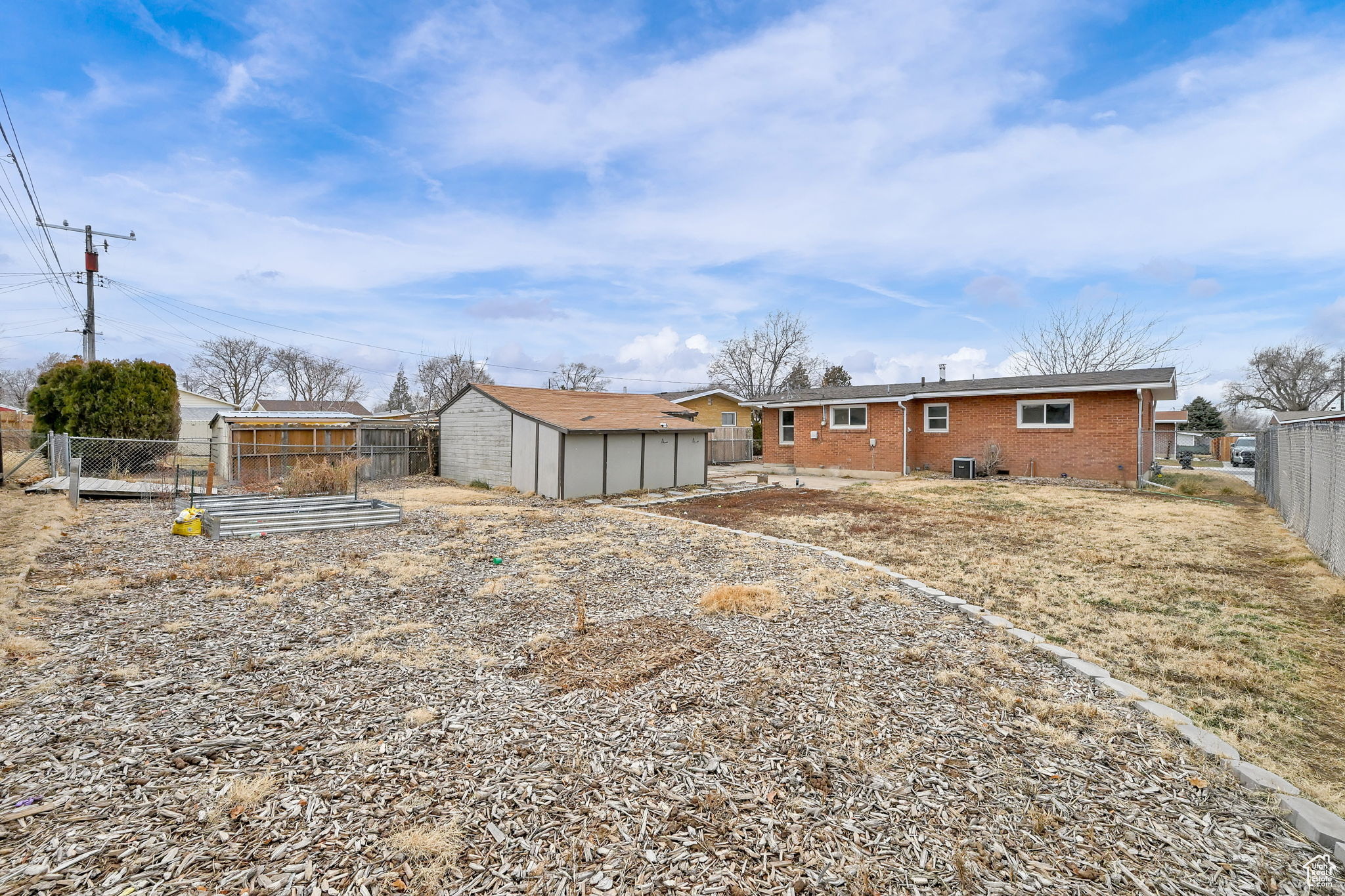 Back of property featuring a shed