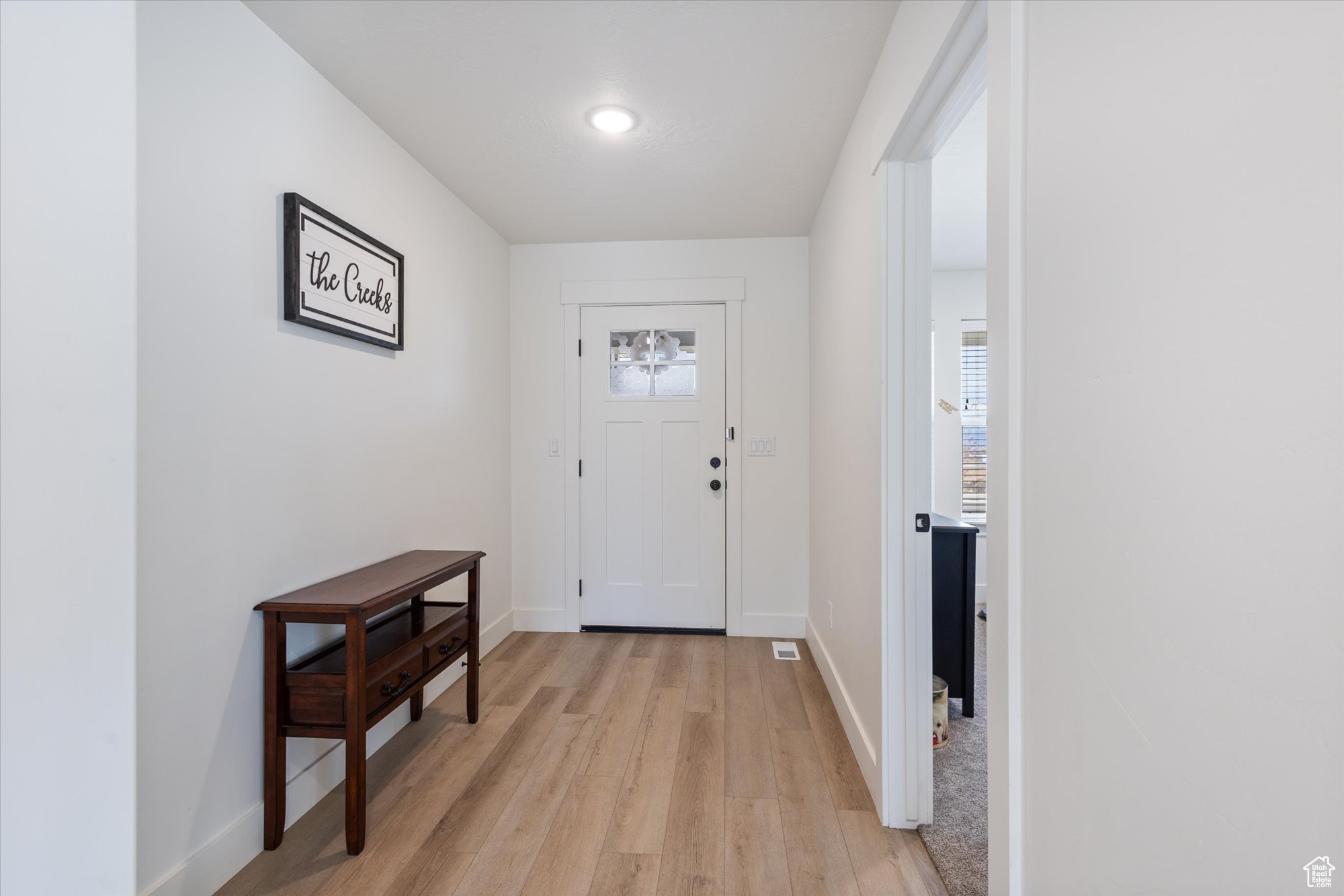 Foyer featuring light hardwood / wood-style floors