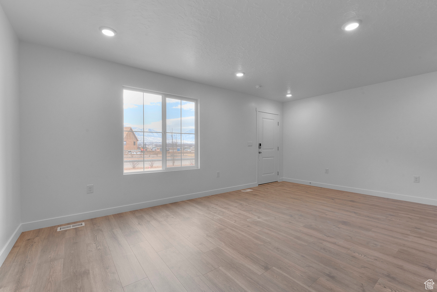 Spare room featuring light hardwood / wood-style flooring