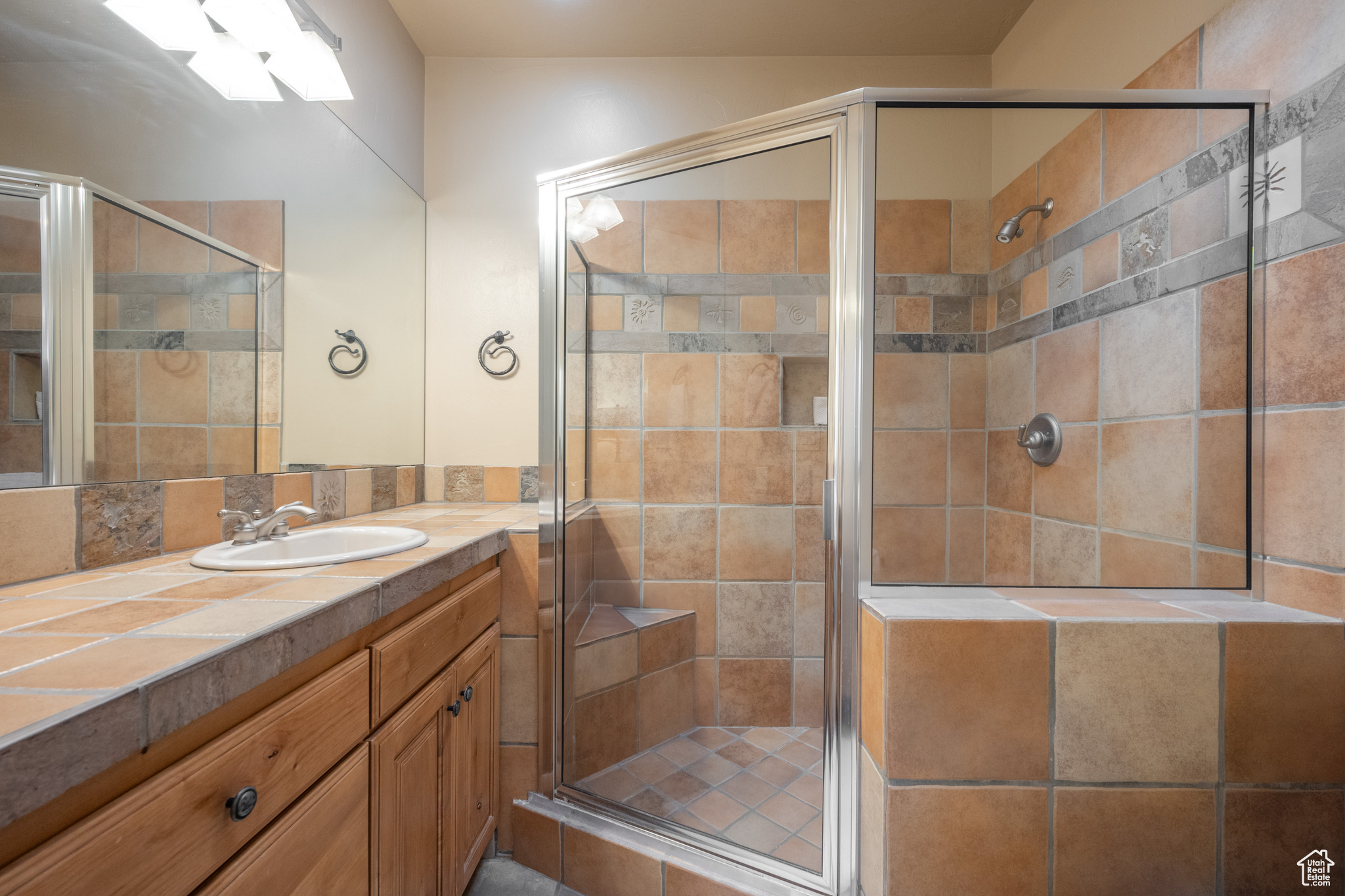 Bathroom with vanity and an enclosed shower