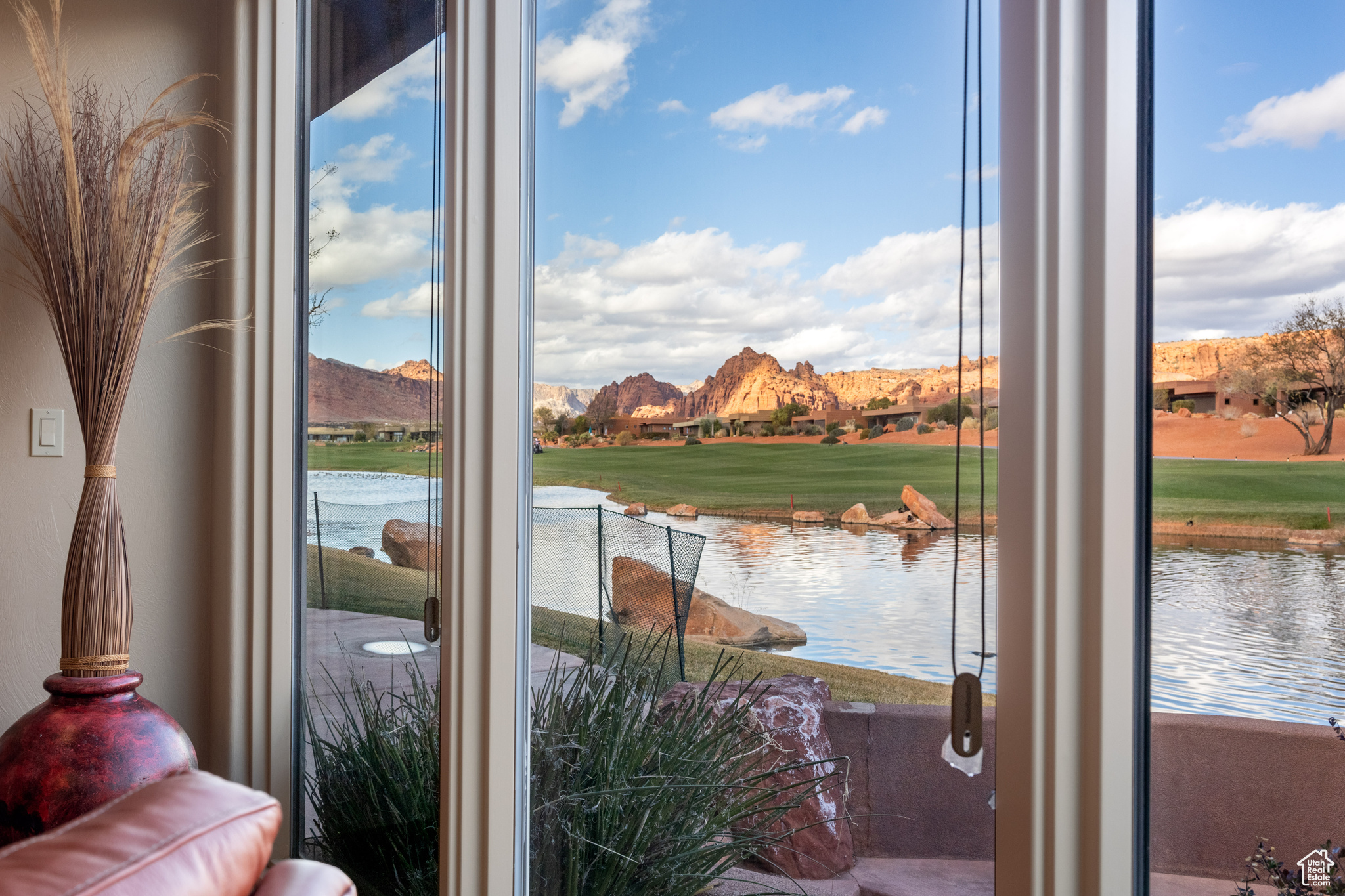 Entryway featuring a wealth of natural light and a water view