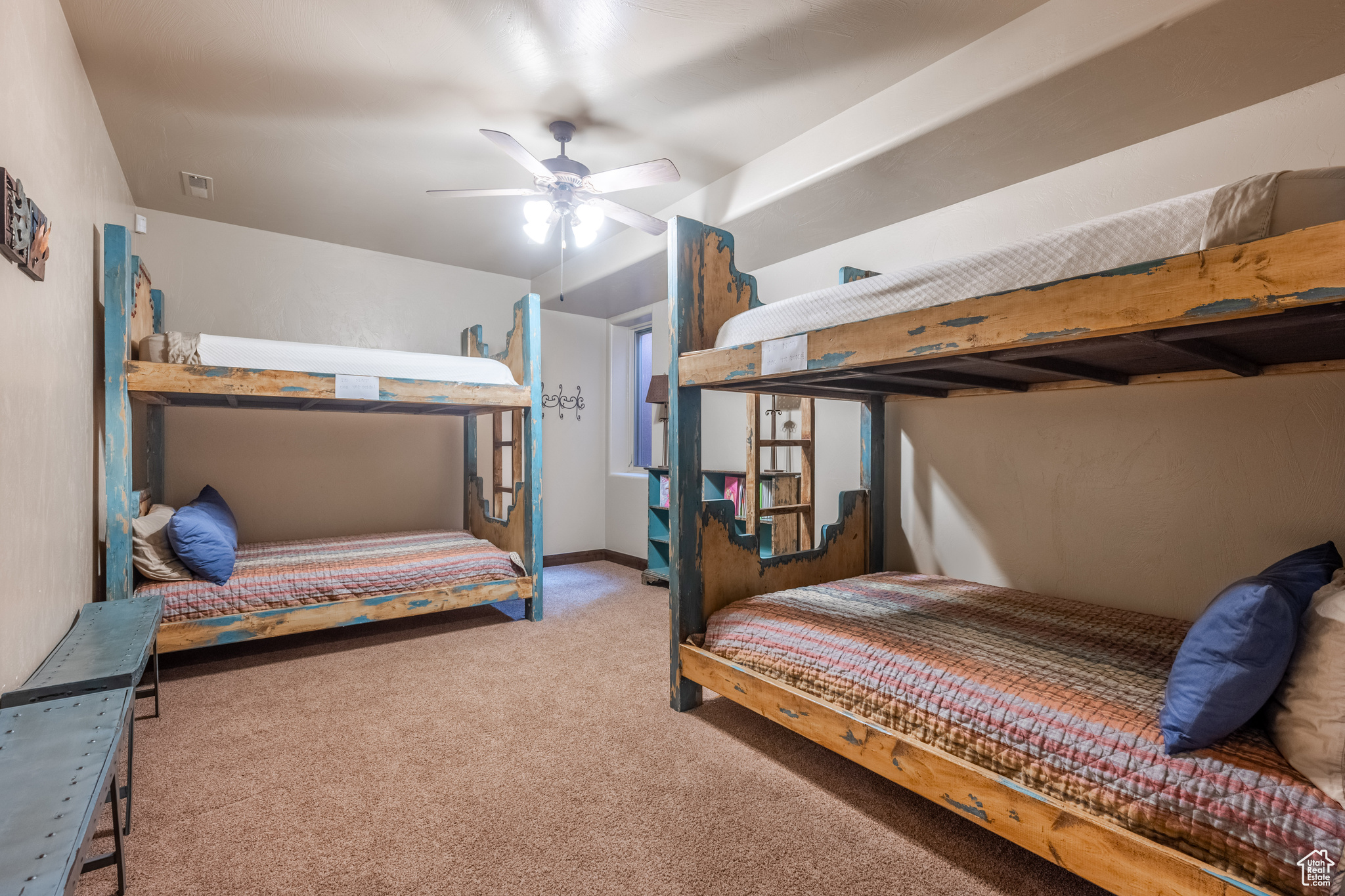 Bedroom with ceiling fan and carpet