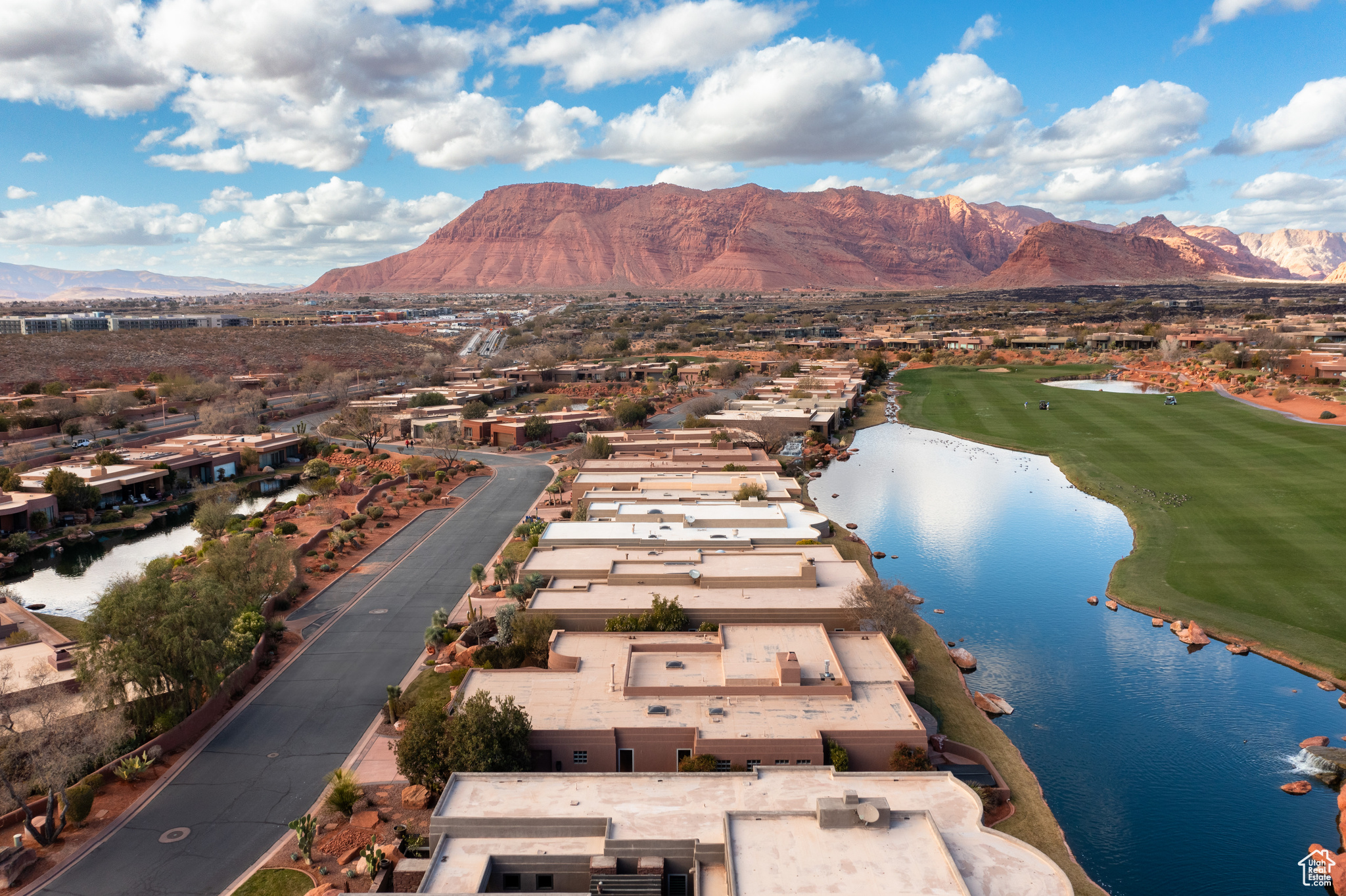 Birds eye view of property featuring a water and mountain view