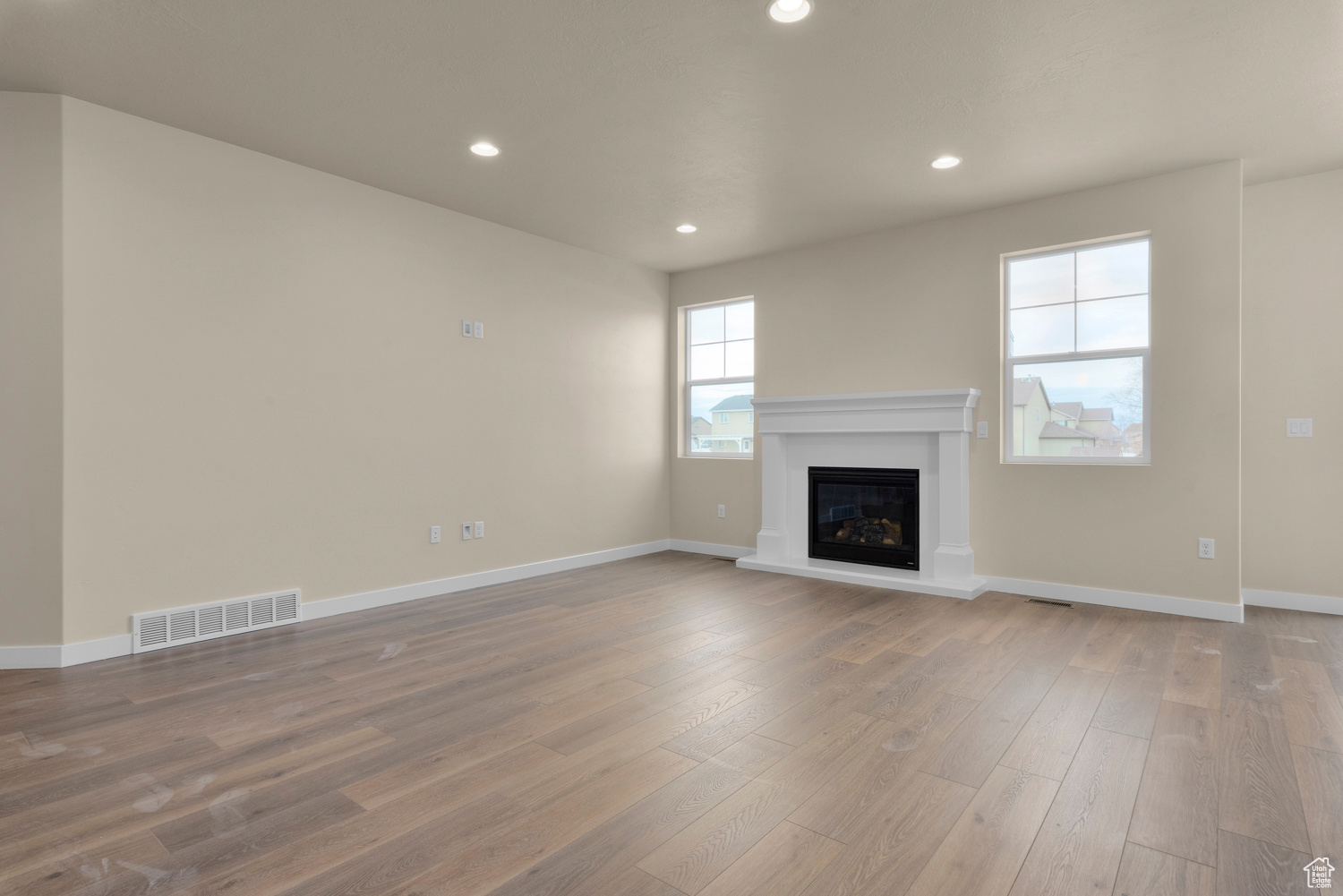 Unfurnished living room with hardwood / wood-style flooring