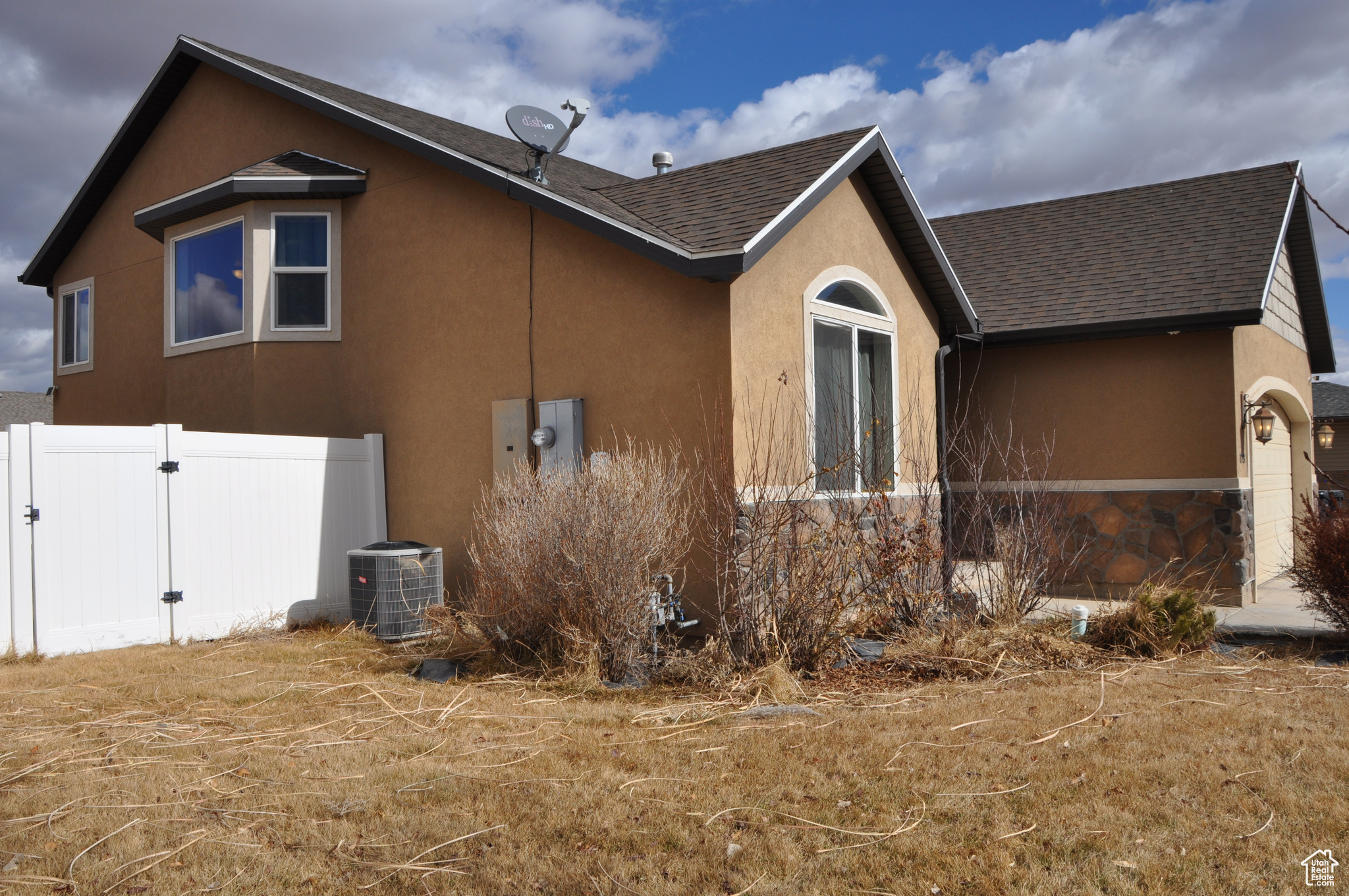 View of home's exterior featuring central AC
