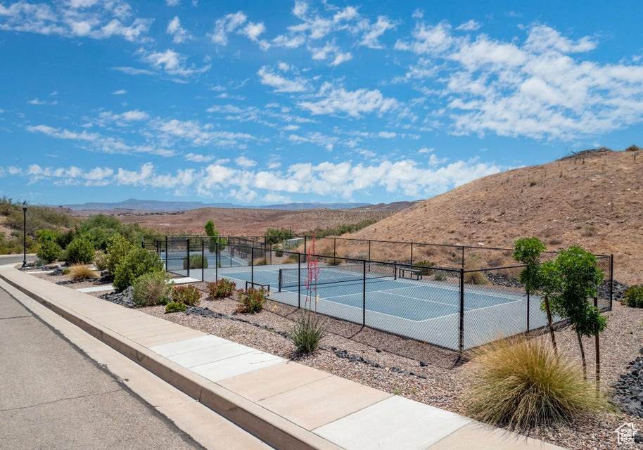 View of tennis court featuring a mountain view