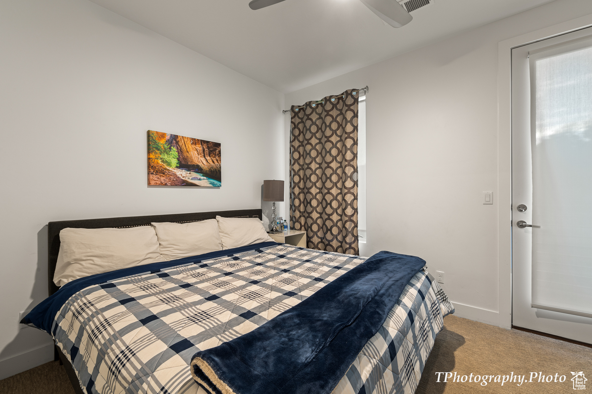 Bedroom with carpet floors and ceiling fan