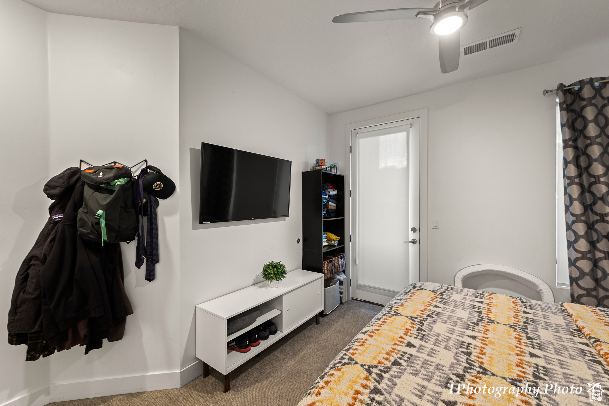 Bedroom with carpet flooring and ceiling fan