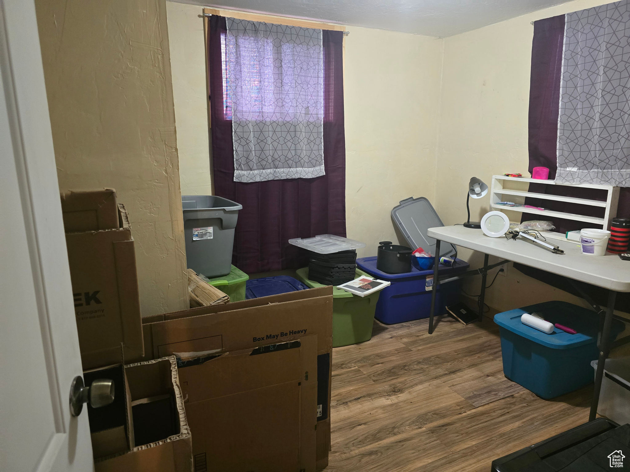 Home office featuring hardwood / wood-style flooring