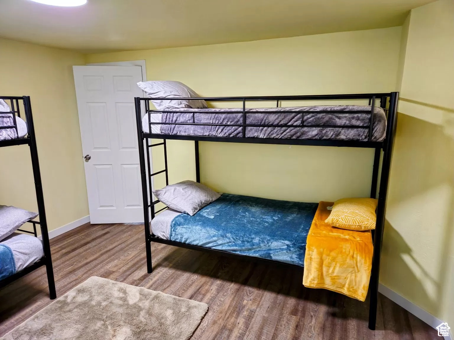 Bedroom featuring wood-type flooring