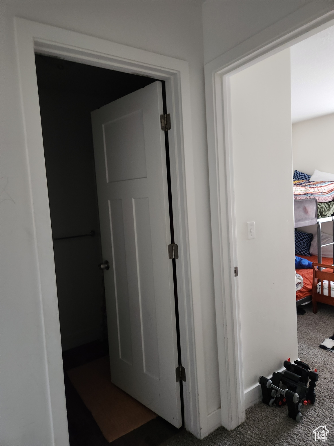 Corridor featuring carpet floors