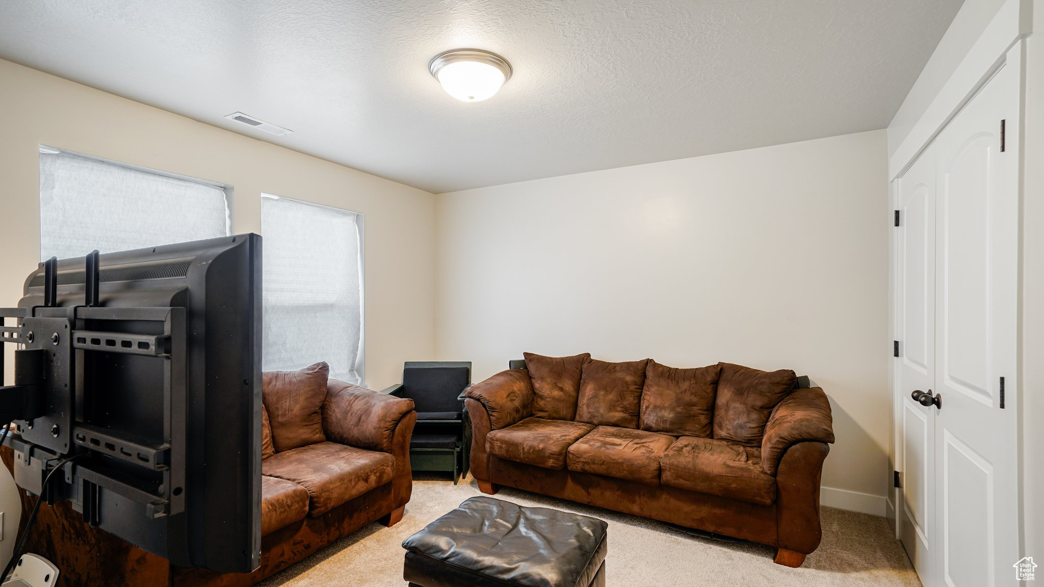 Bedroom/TV room  featuring carpet floors