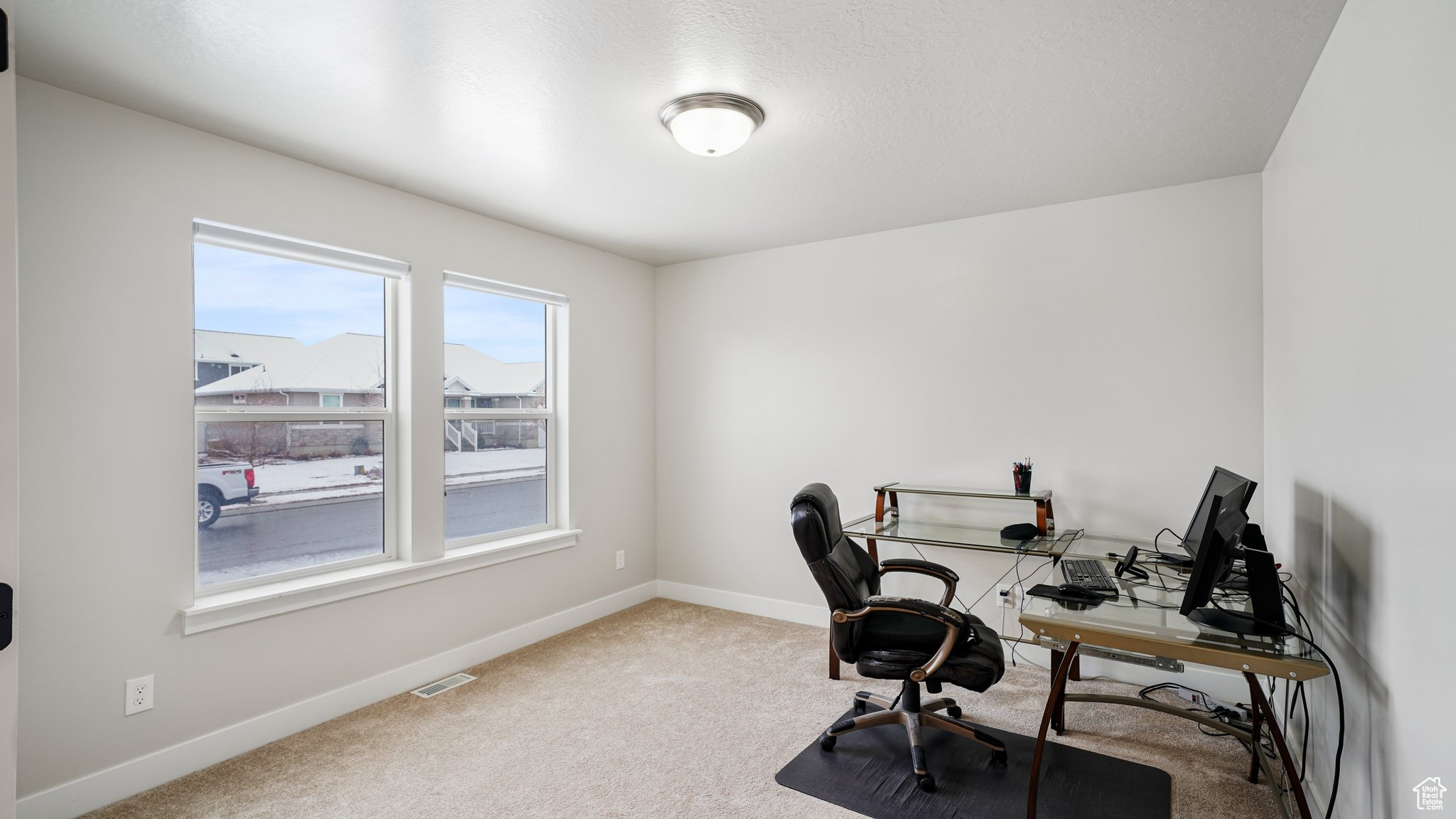 Office/ bedroom area with carpet flooring