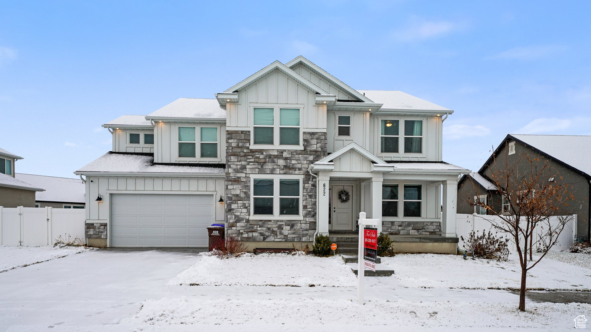 Craftsman-style house featuring a garage