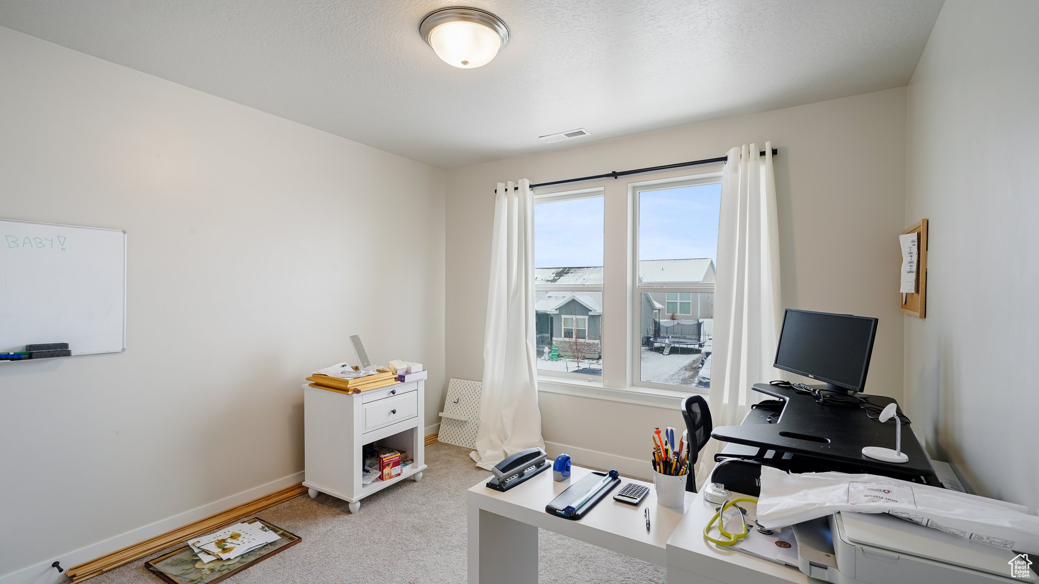 View of bedroom/office carpeted office space